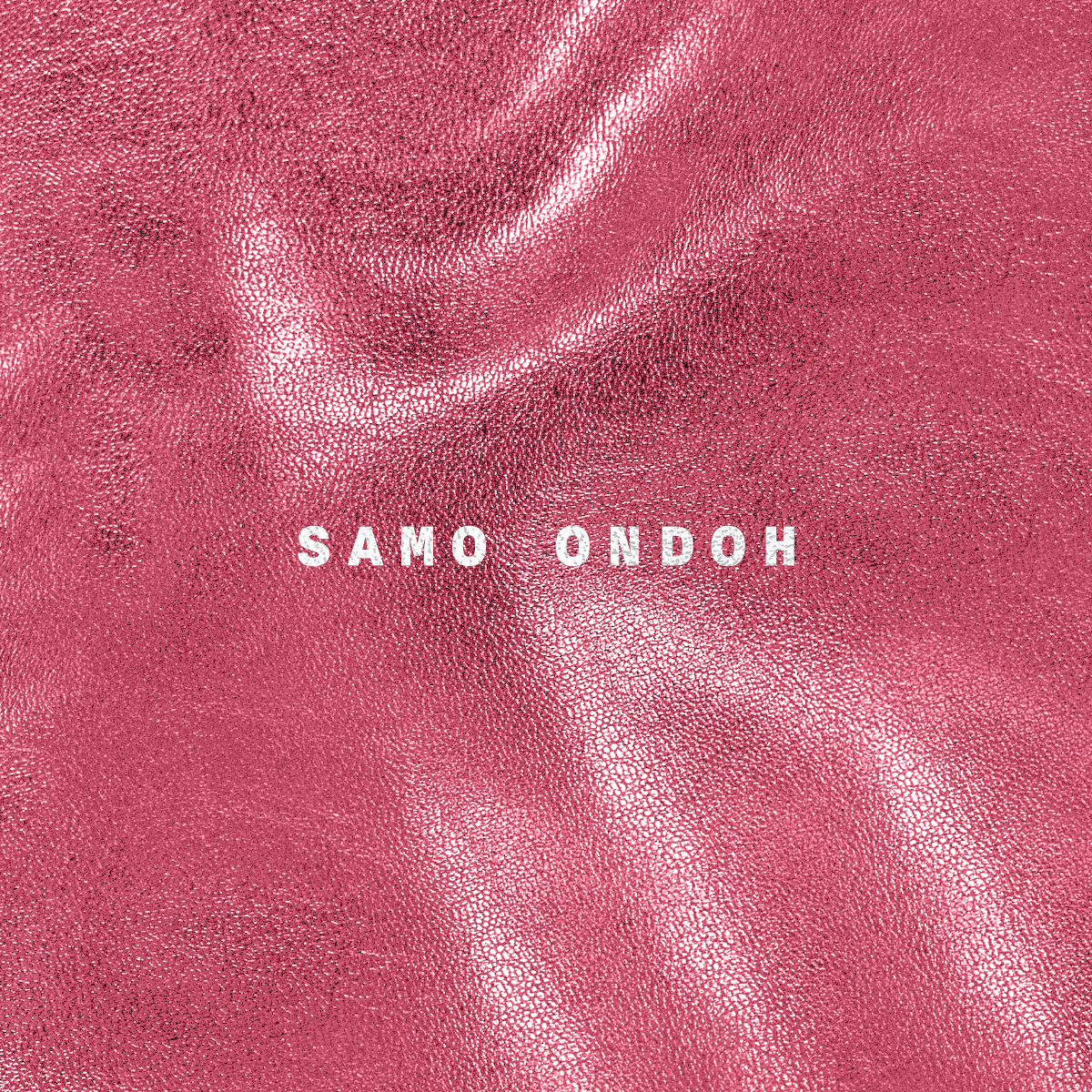 Pink metallic fabric with the name Samo Ondoh in white capital letters across the center.