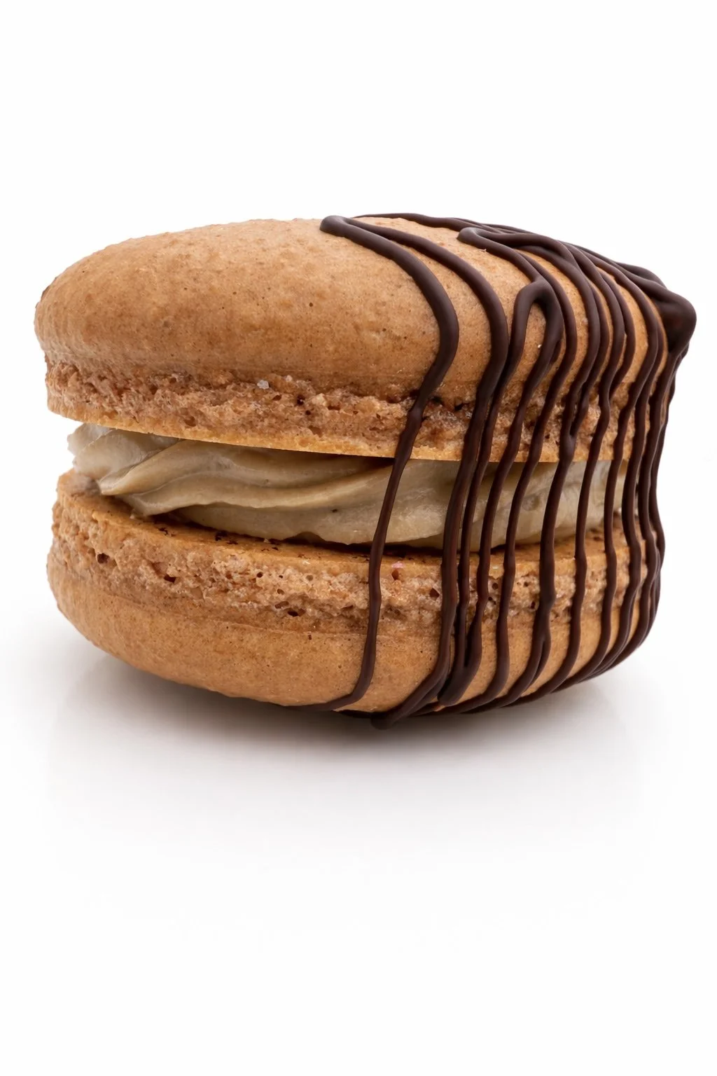 Mocha French macaron with espresso buttercream and chocolate drizzle by Mondelo Bake Shop in Miami. (Copy)