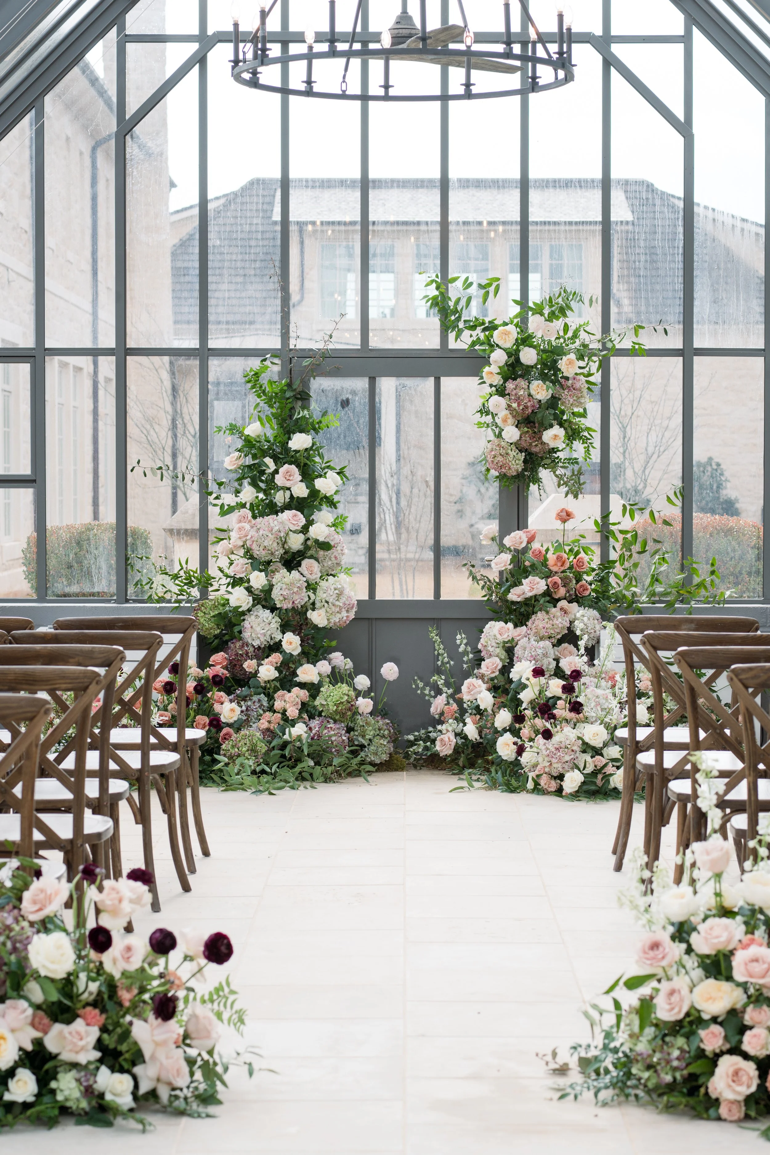 Asymmetrical ceremony floral arch provides the perfect structure to complete your "I do's" 