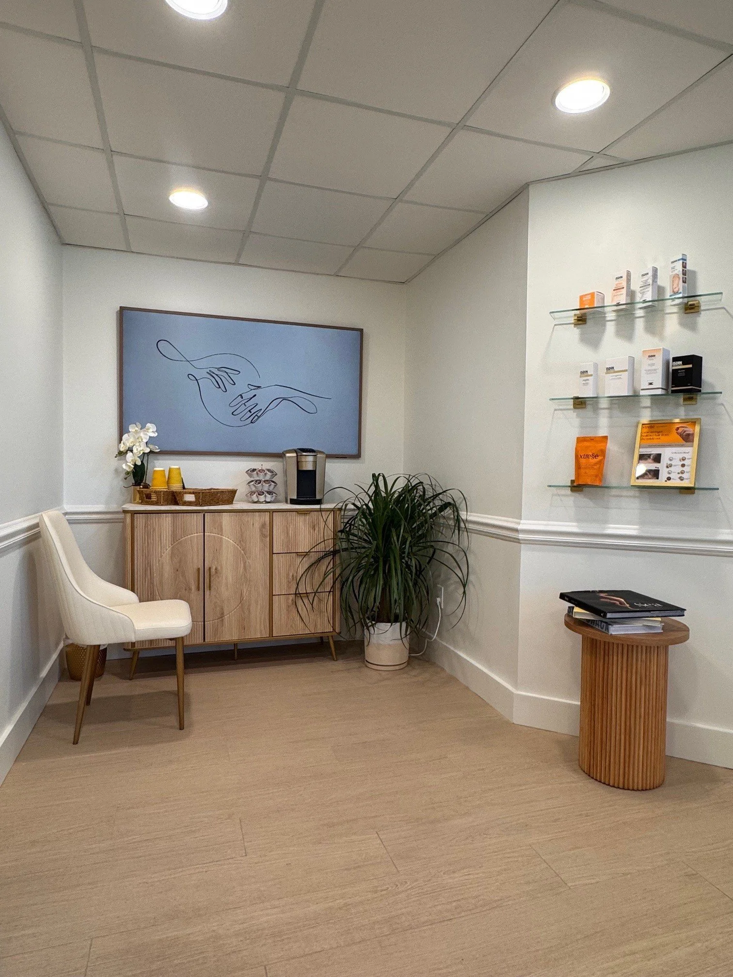 Interior of Isla Dermatology office with reception area and product display