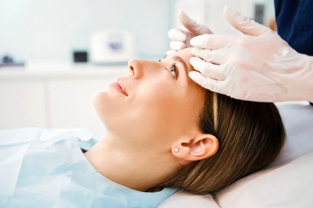 Patient receiving cosmetic dermatology treatment in Isla Dermatology Key West office