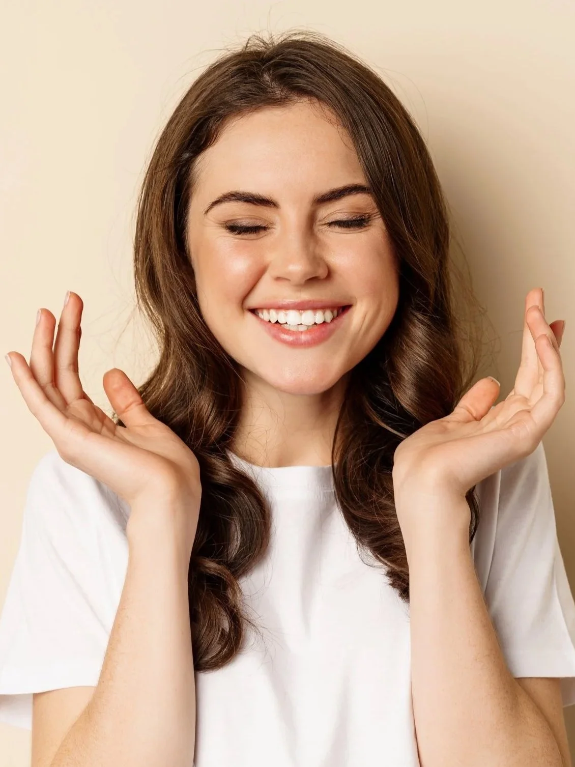 Smiling woman representing general dermatology services at Isla Dermatology in Key West