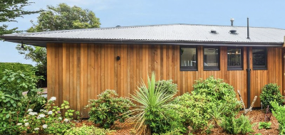 
The exterior of the home has been completely refreshed, with the original brick façade professionally clad to create a modern cedar-look finish. This upgrade gives the property a warm, contemporary appearance while maintaining the solid structure of