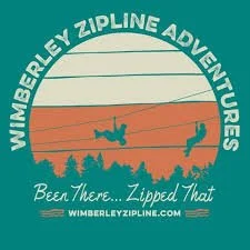 Logo for WimBEY Zipline Adventures featuring a circular design with a teal background, a rainbow, a person ziplining, and trees with the slogan "Been There...Zipped That" and website "WIMBEYZIPLINE.COM".