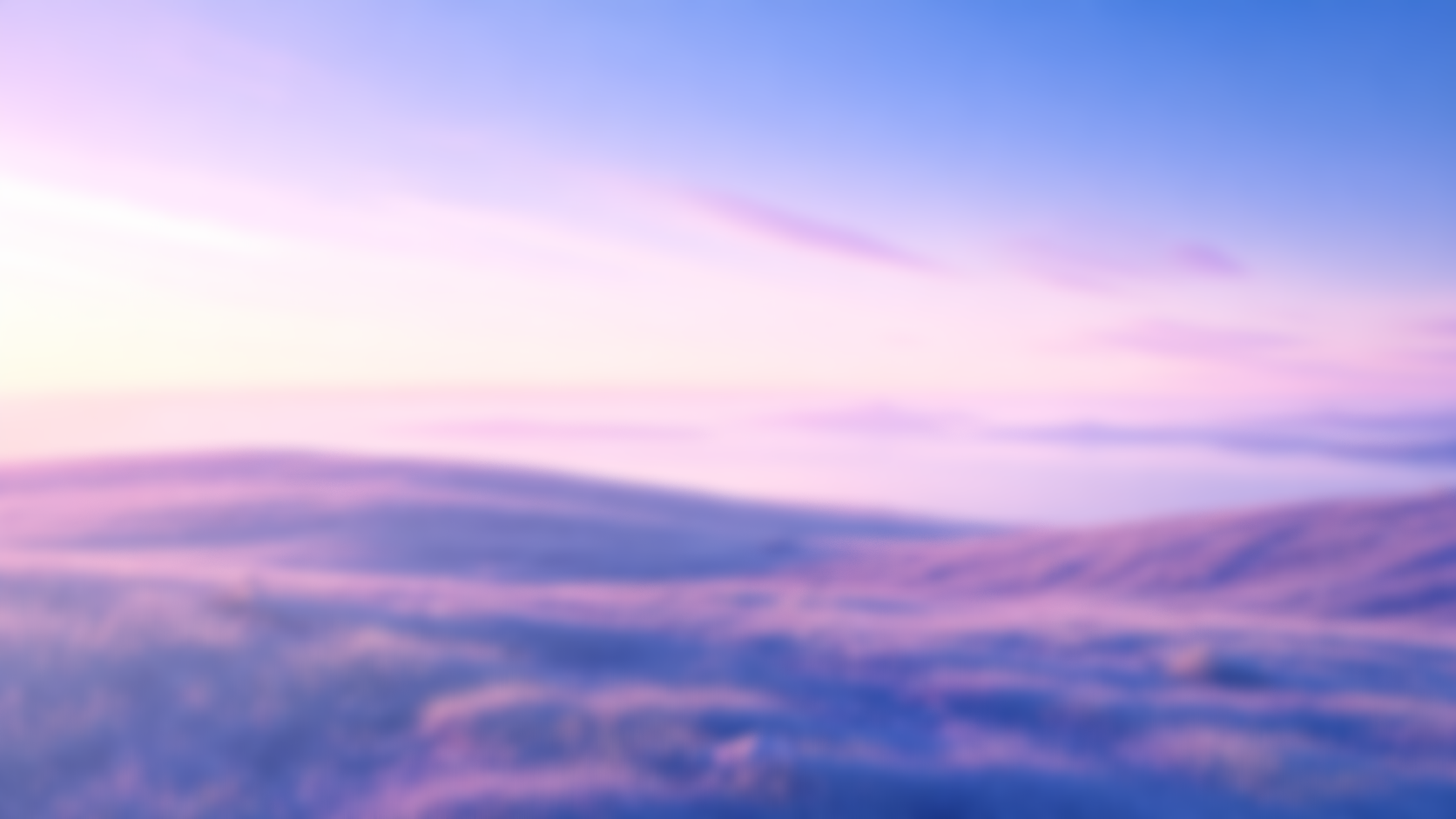 A blurred image of the sky with shades of purple, pink, and blue over a body of water, resembling a colorful sunset or sunrise.