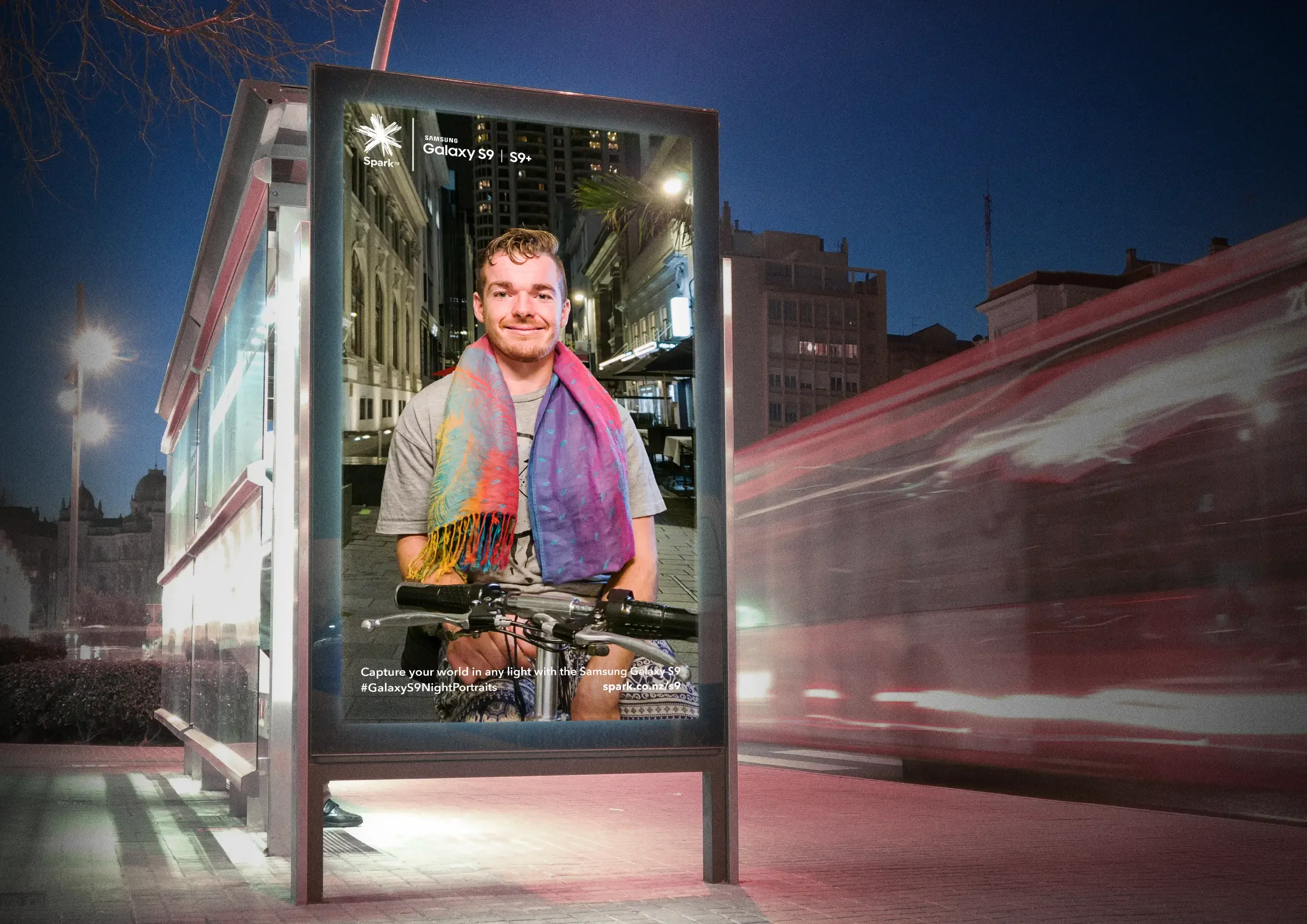 Night portrait of guy displayed in outdoor advertising using Samsung Night Portrait mode