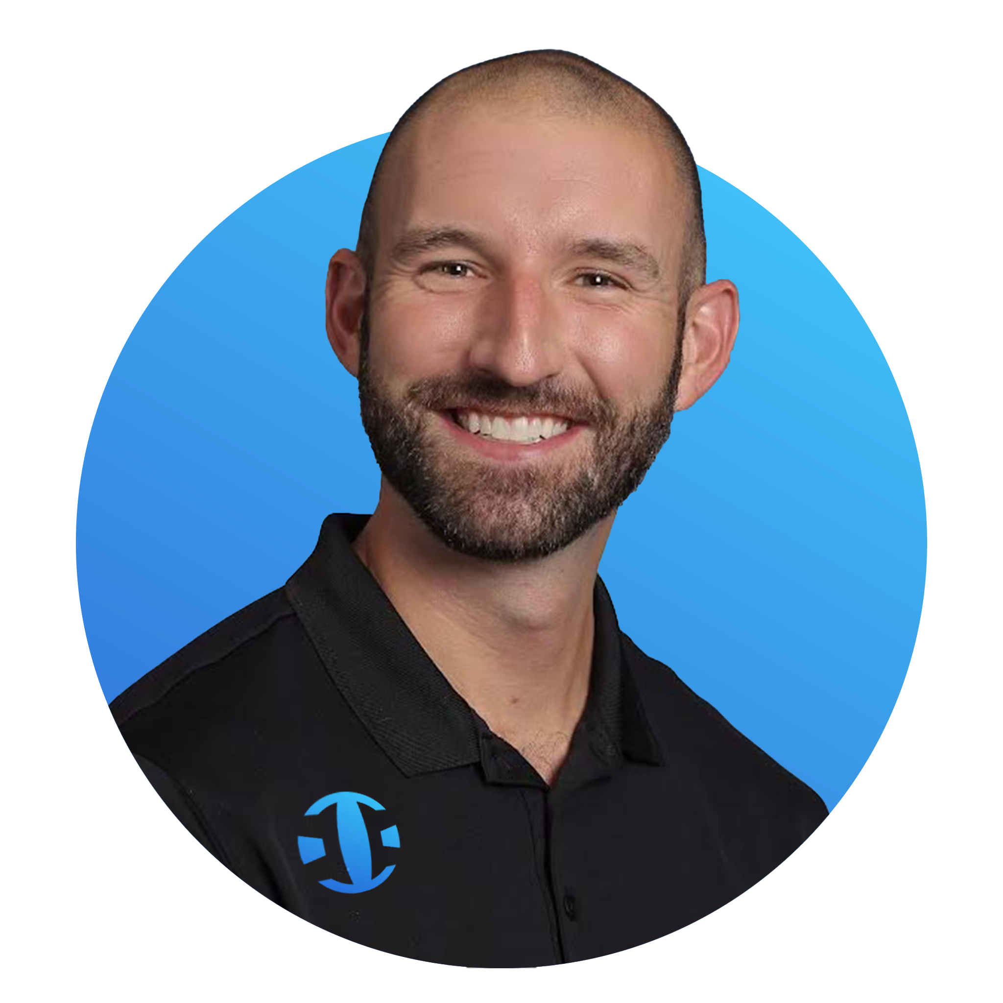 A smiling man with a beard and short hair wearing a black collared shirt with a blue logo. The background is blue.