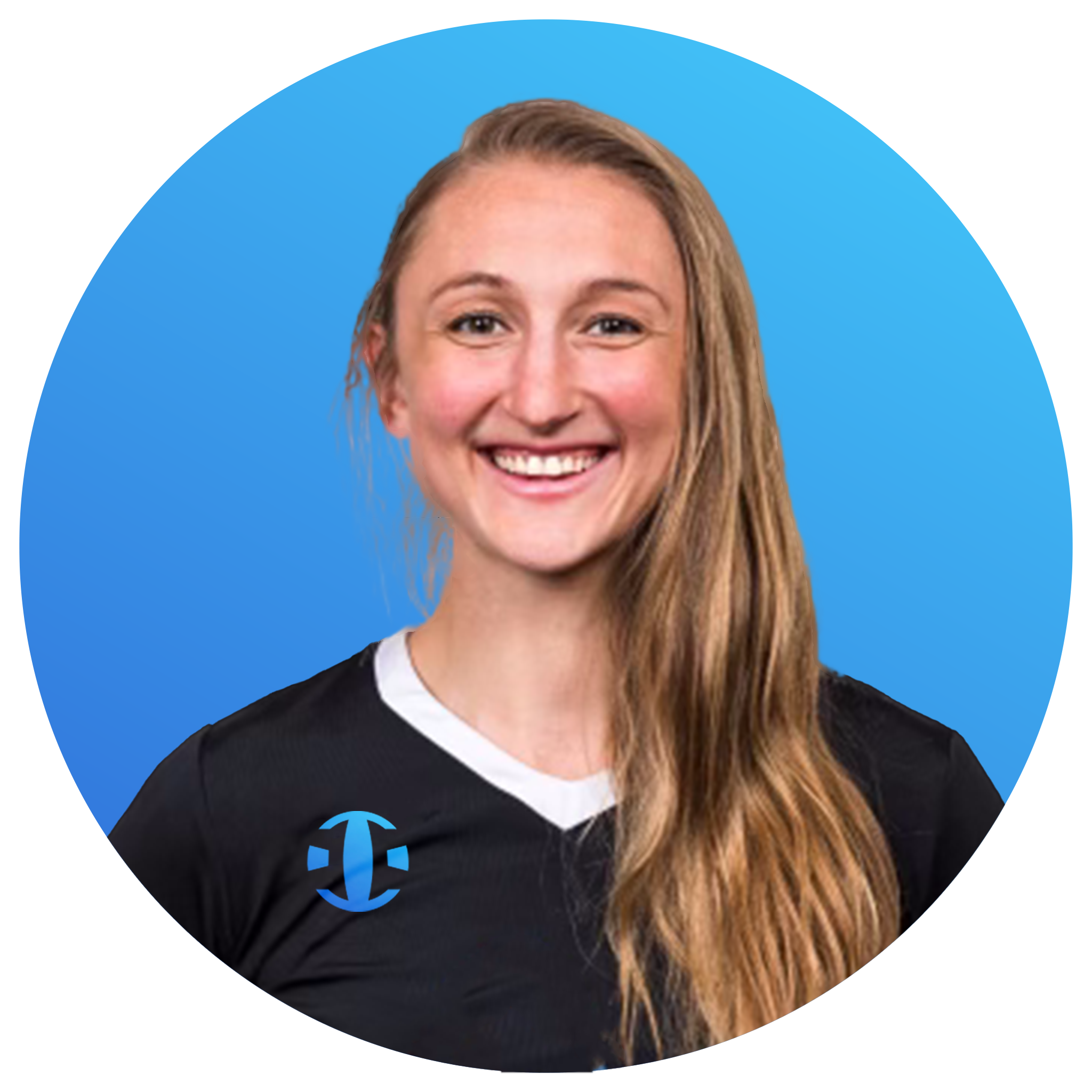 A smiling woman with long, wavy light brown hair wearing a black sports jersey with a blue and black logo on the front, set against a blue background.