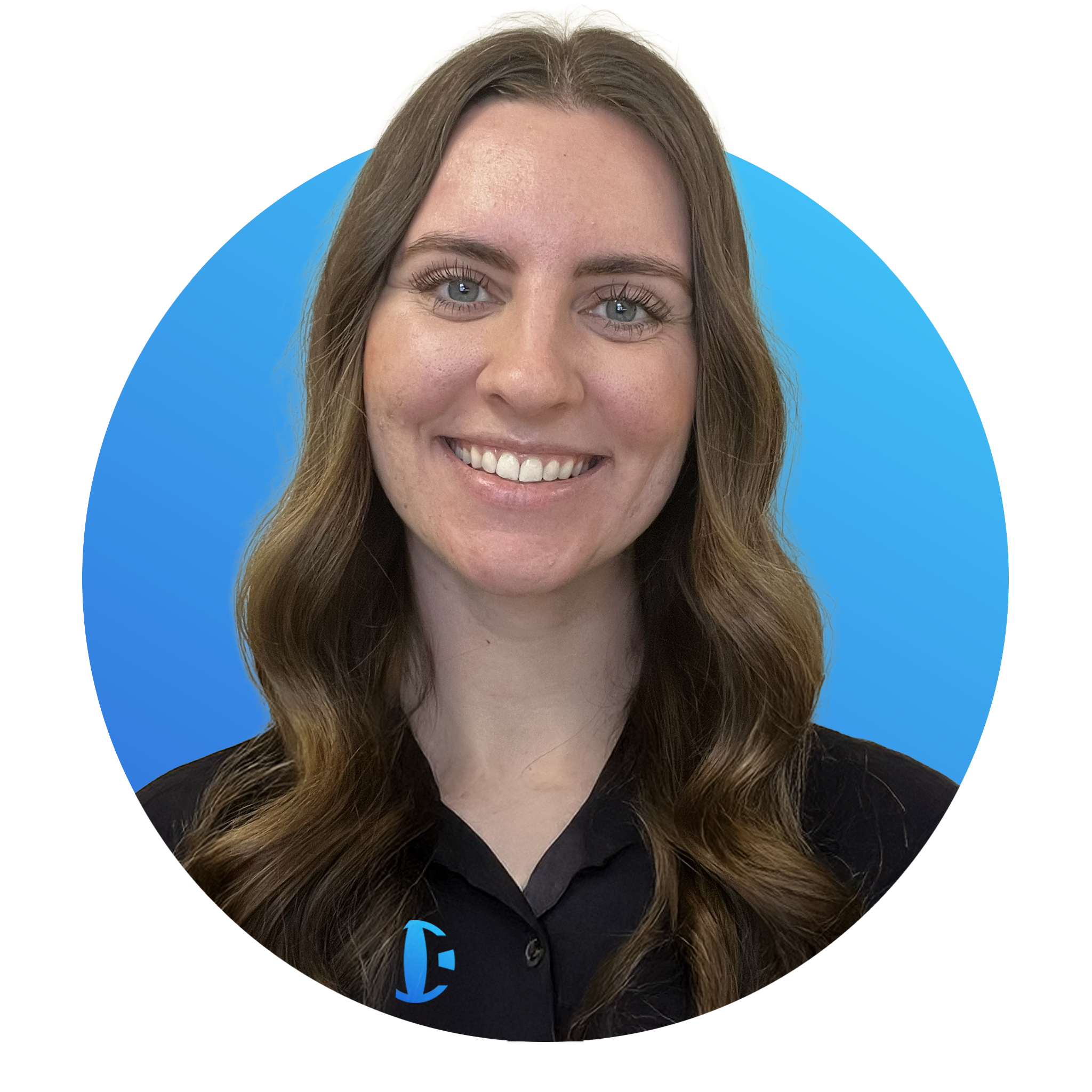 A young woman with long, wavy brown hair and blue eyes smiling at the camera, wearing a black collared shirt with a blue logo, against a blue background.