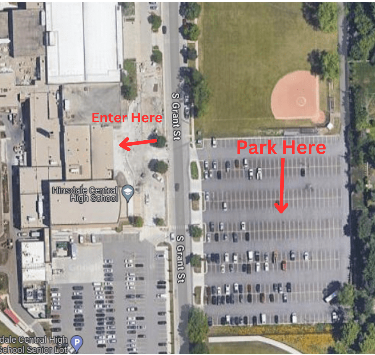 Aerial view of Hinsdale Central High School with parking lot and baseball field; red text and arrows indicate designated entrance and parking areas.