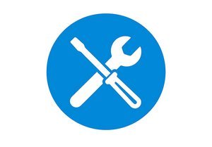 Símbolo circular azul con una llave inglesa y un destornillador cruzados en el centro, que indica herramientas o reparación.