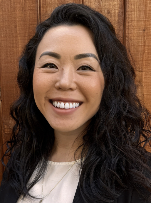 Amanda Lee, trauma-informed leadership and alignment coach at The Bench, smiling in a professional portrait