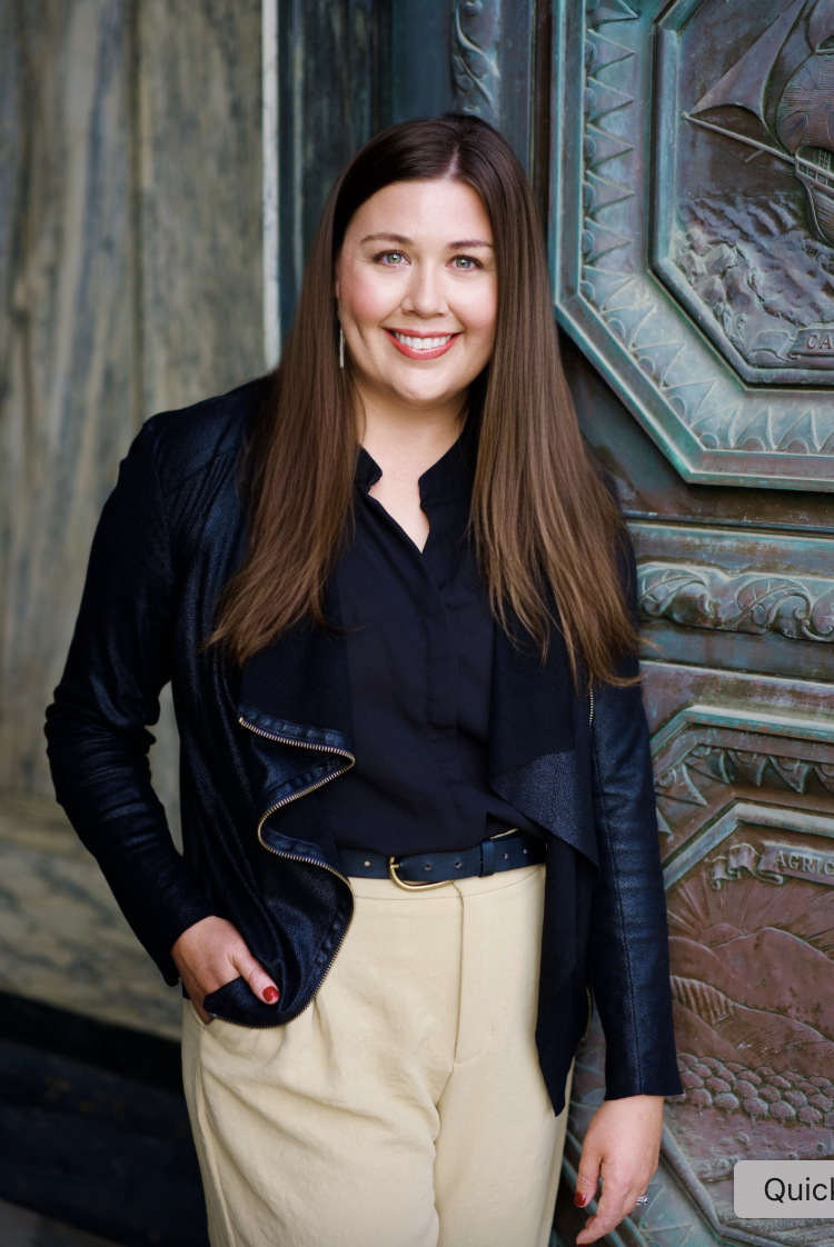Professional headshot in the street of Natalie, confident and approachable.