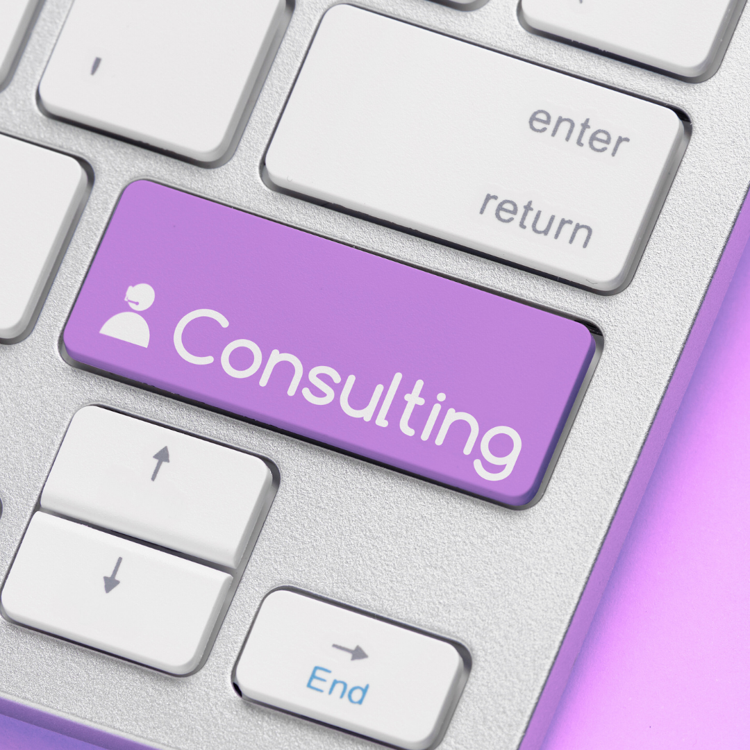 Close-up of a computer keyboard with a purple key labeled 'Consulting' and a white icon of a person in a circle.