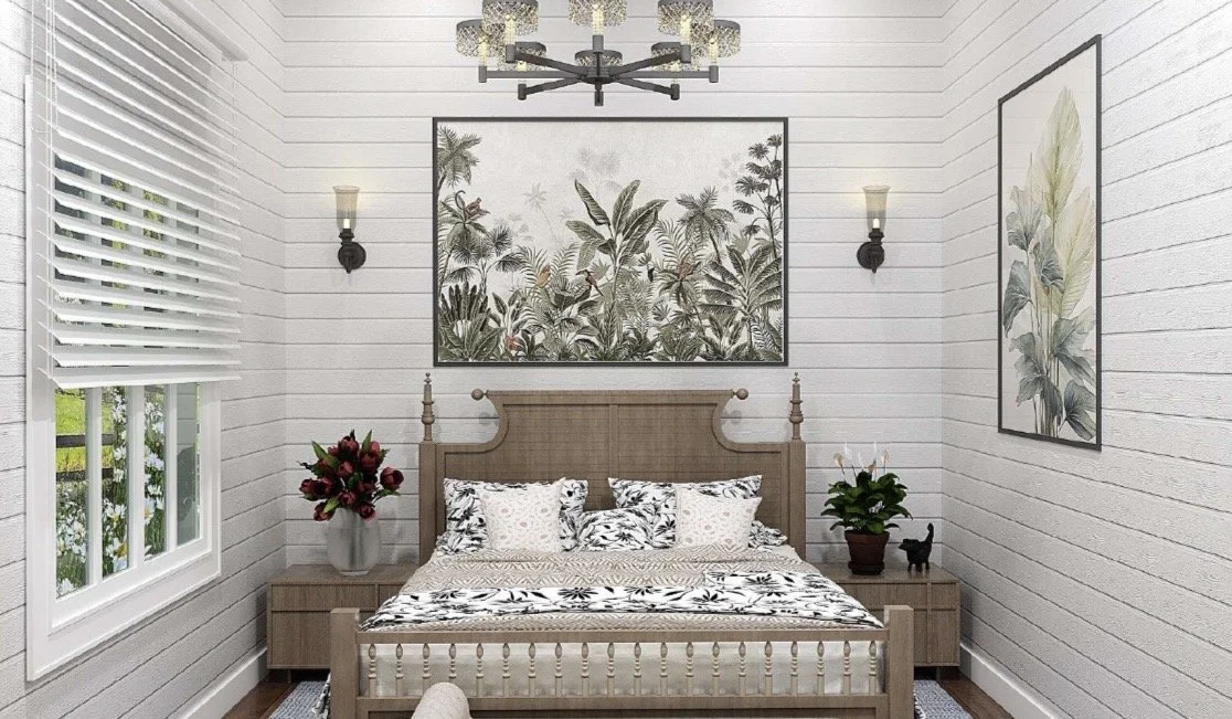 A bedroom with white horizontal wood panel walls, a large window with white blinds, a wooden bed with a patterned black and white bedding, two bedside tables with plants and decorative items, framed plant-themed art on the wall, wall sconces, and a modern chandelier hanging from the ceiling.