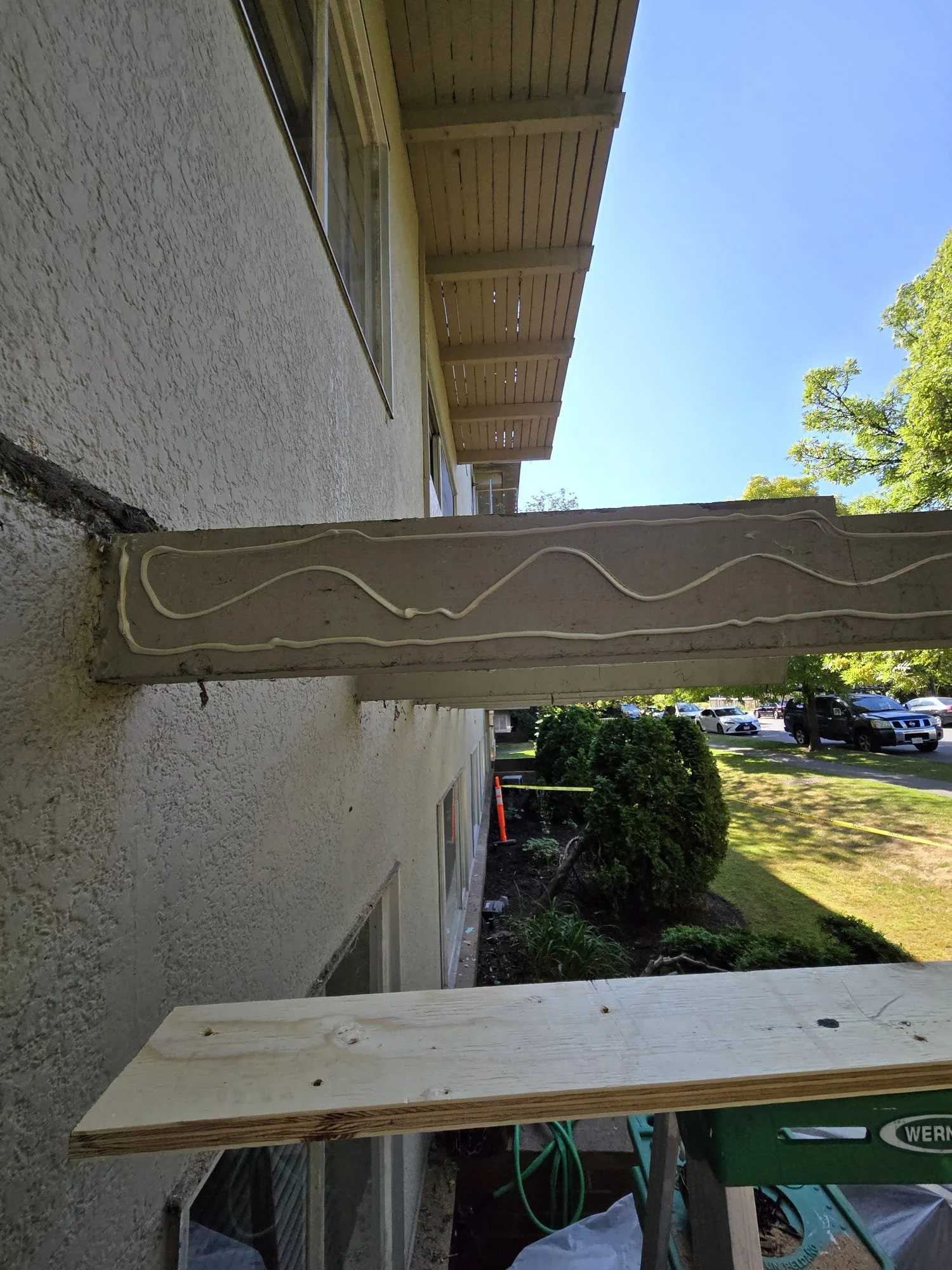 The repair underway, new material is glued and screwed on