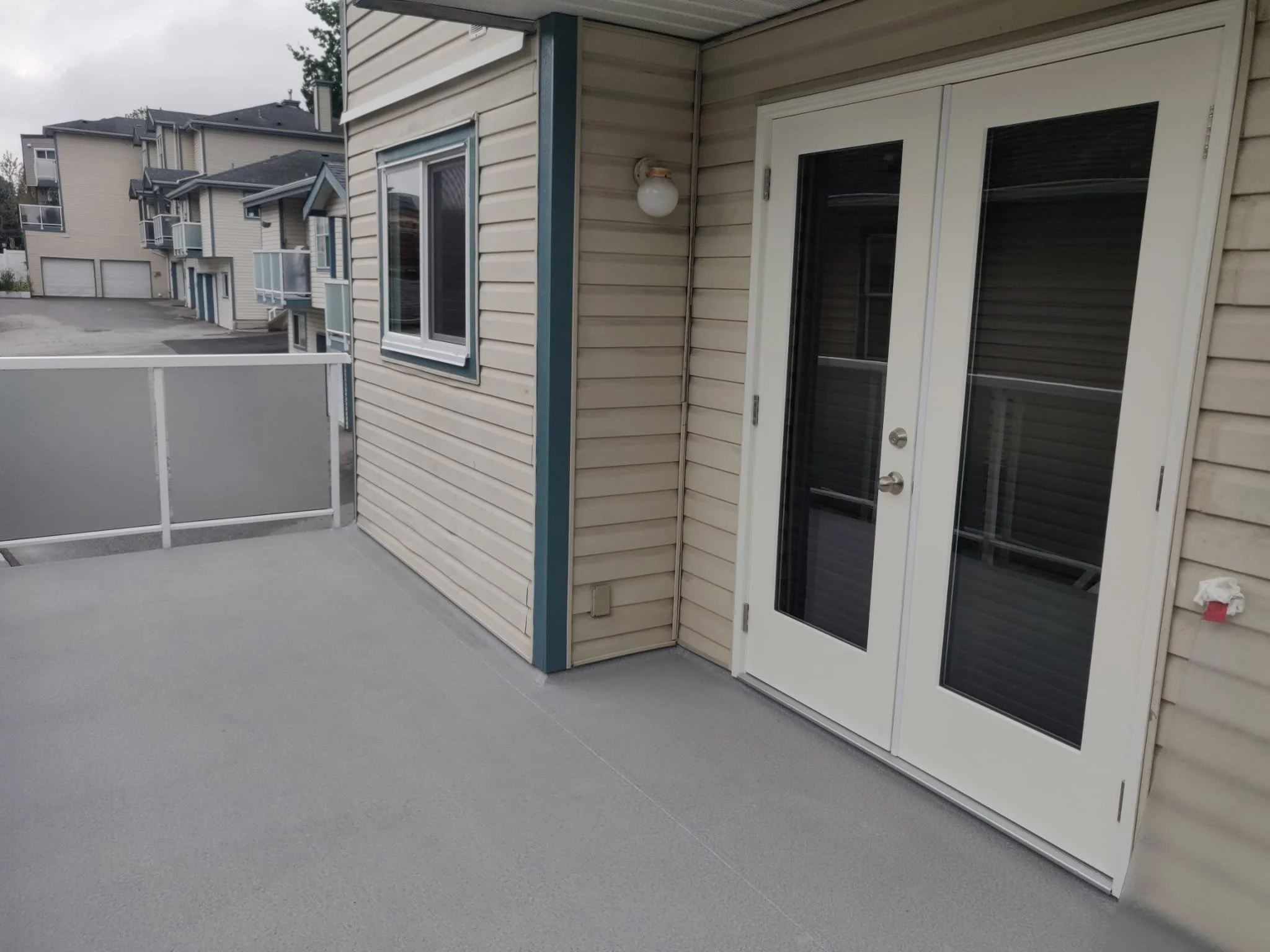 Re-installed existing guardrails and new window, french door and balcony waterproofing membrane