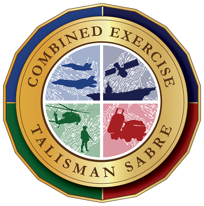 A circular emblem with four quadrants featuring military training images, surrounded by a gold border with the words 'Combined Exercise' at the top and 'Talisman Sabre' at the bottom, with green, black, red, and blue sections on the outer edge.