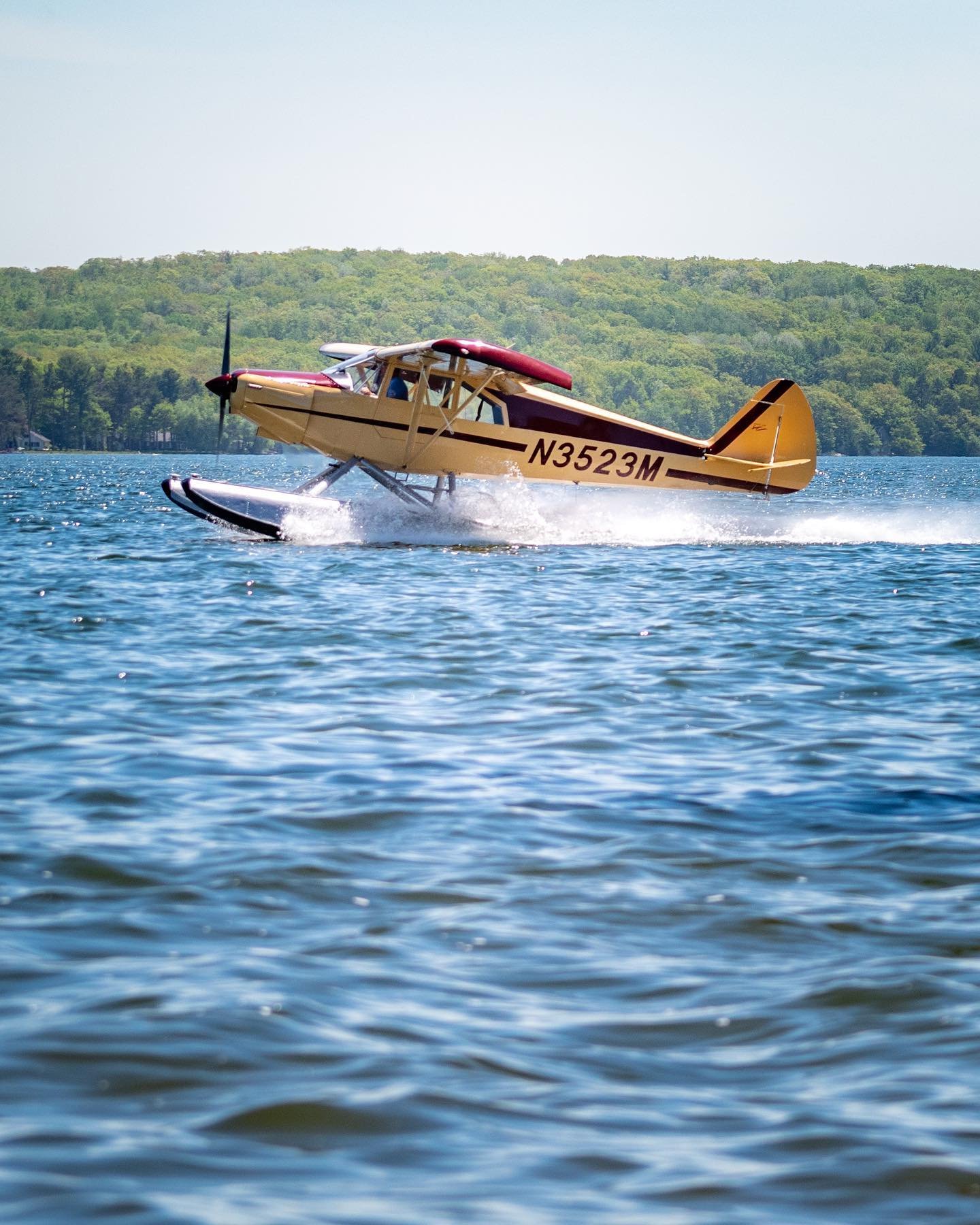 Floatplane performing water takeoff during seaplane flight training in Michigan