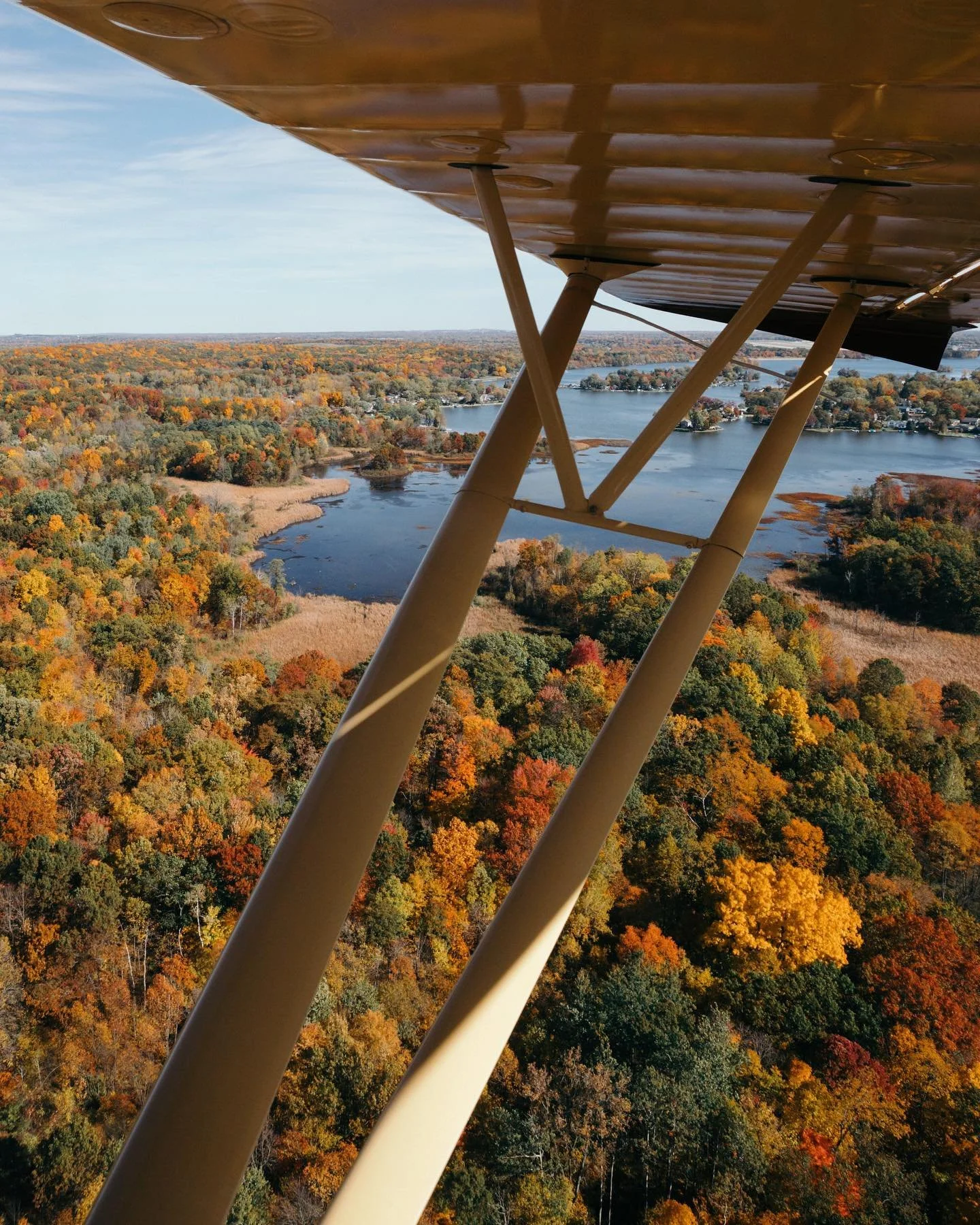 Scenic seaplane flight over Michigan lakes during peak fall colors