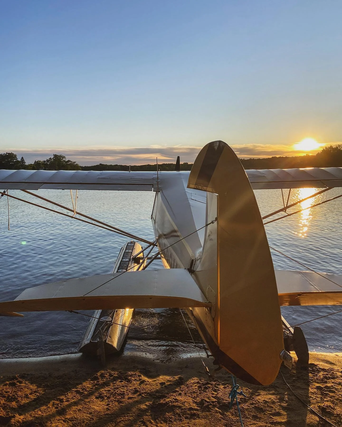 Seaplane on floats moored at sunset on a Michigan lake