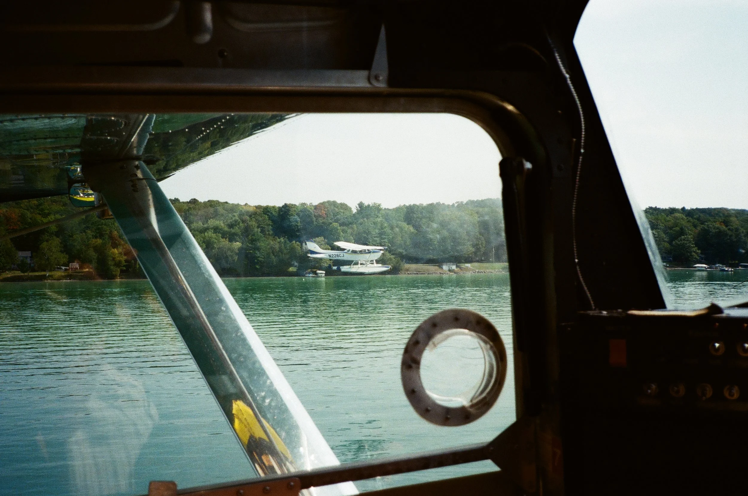 Cockpit view during a scenic seaplane flight over a Michigan lake