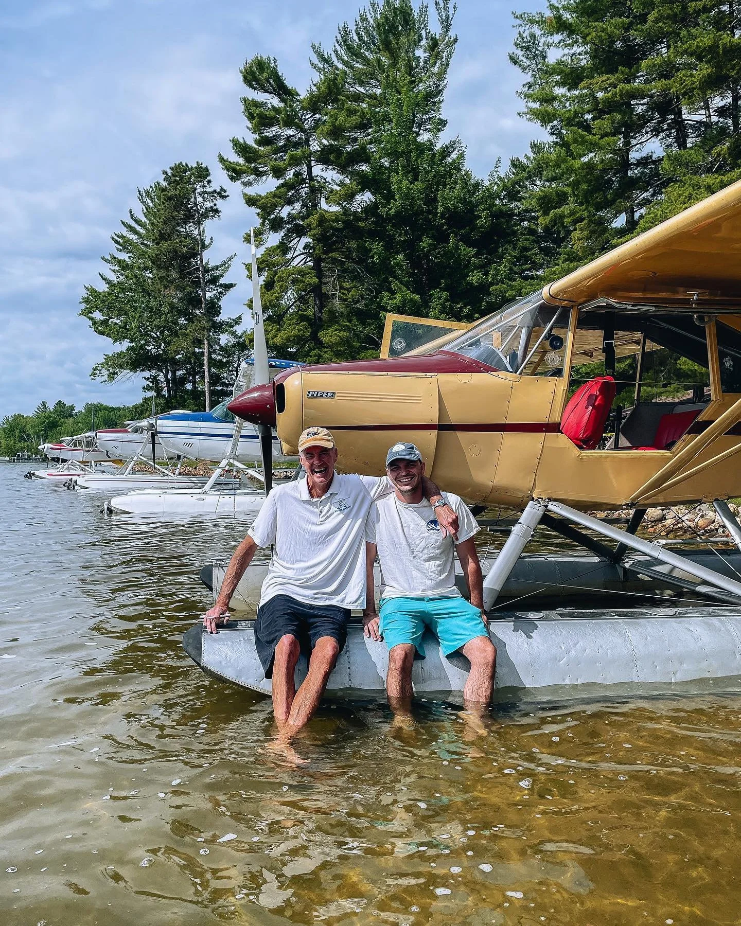 Pilots enjoying time on a seaplane at a Michigan lake after a flight