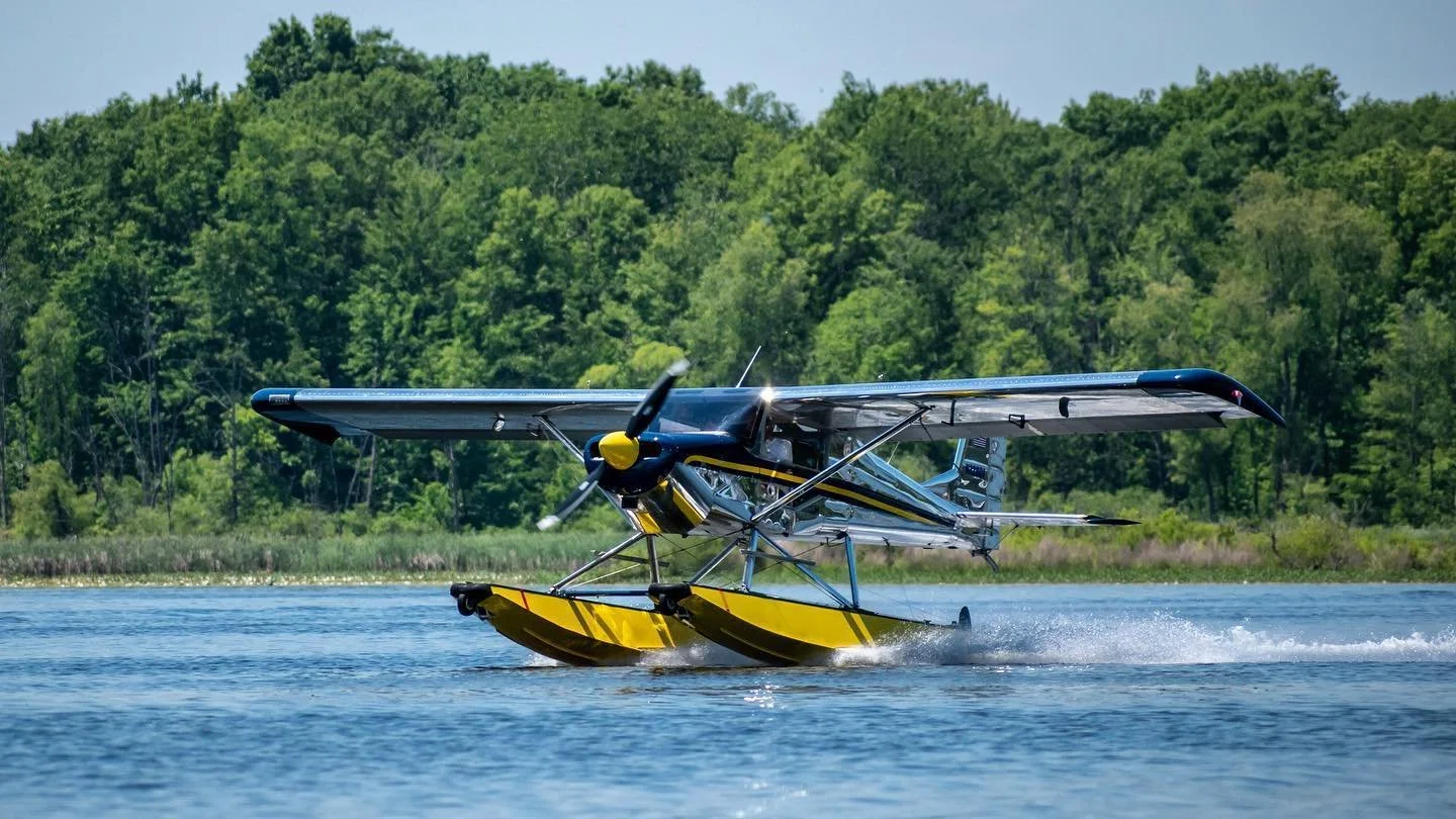 Floatplane on takeoff from a Michigan lake during a scenic seaplane flight