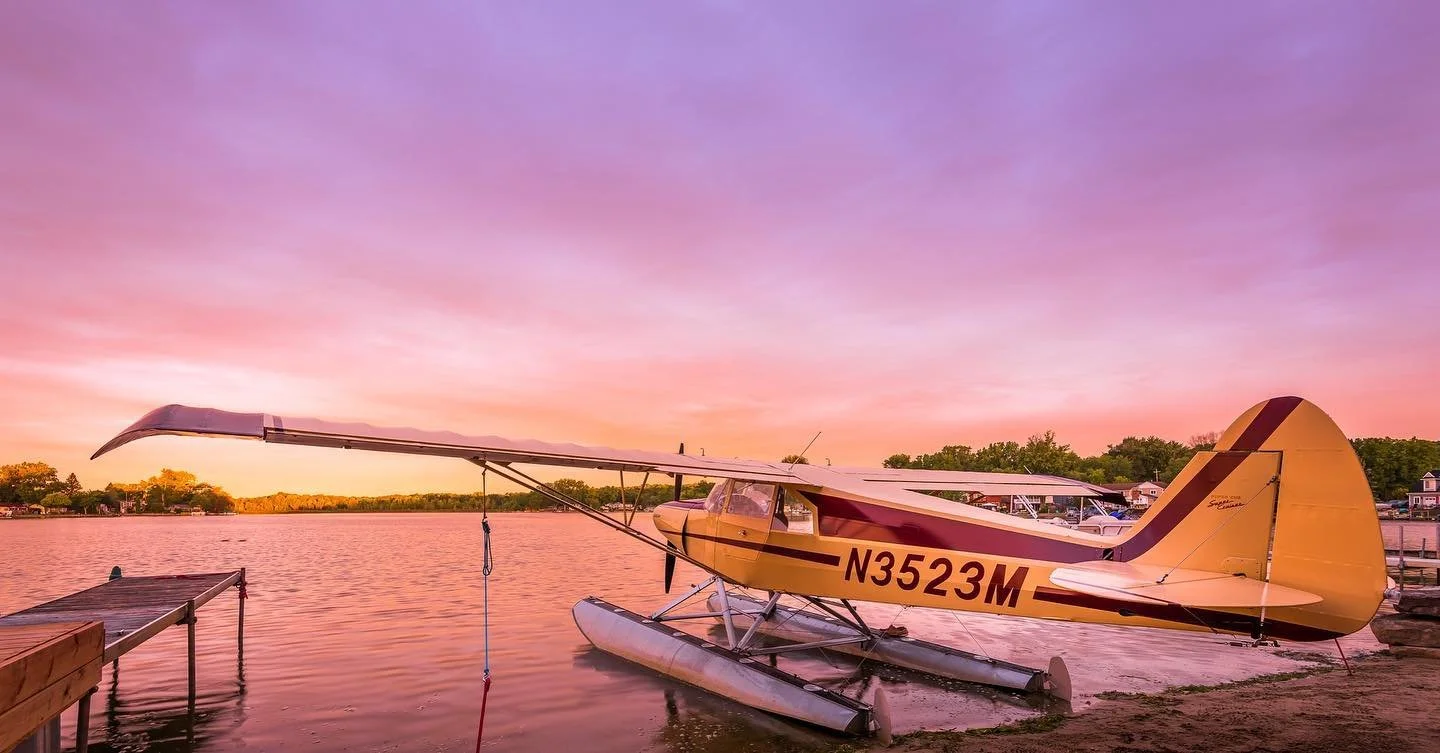 Seaplane resting on the water at sunset before a scenic flight in Michigan