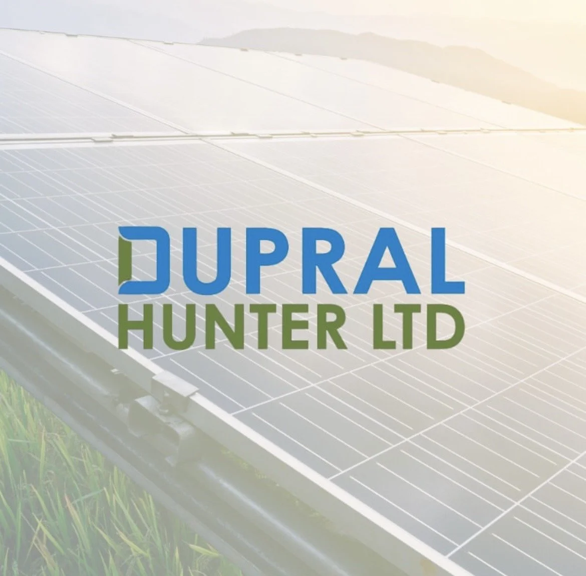Solar panels installed on a structure in a grassy field with the logo 'DUPRAL HUNTER LTD' overlaid.