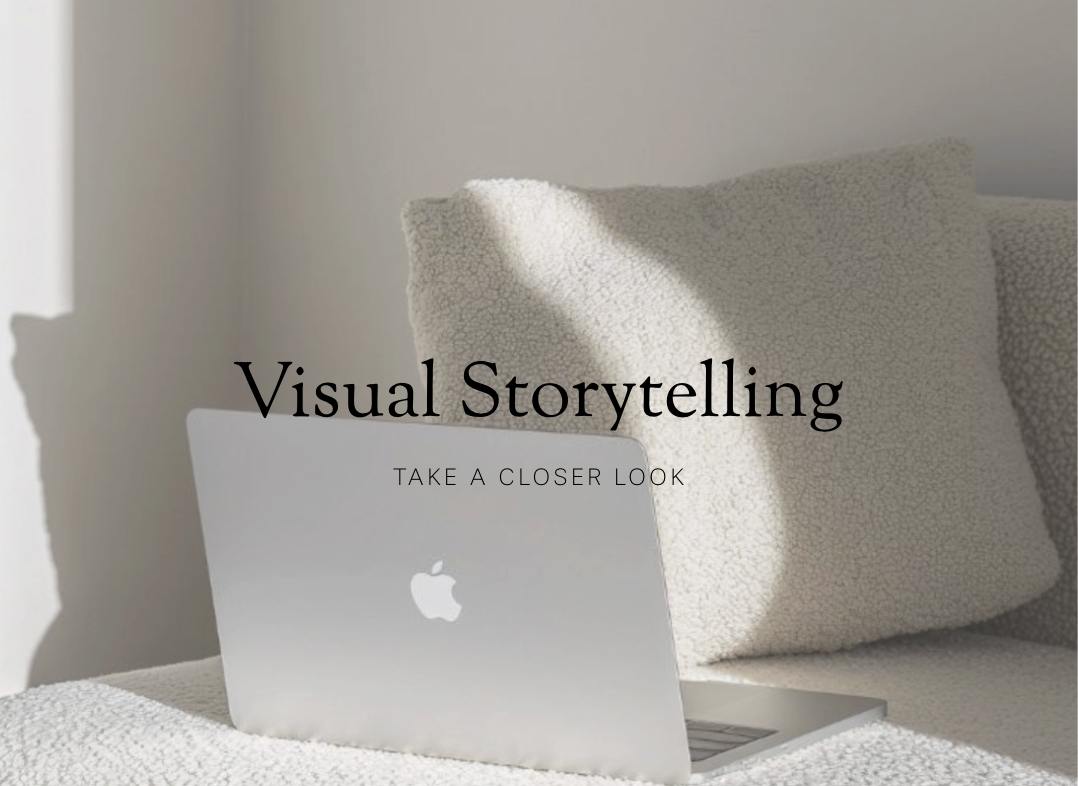 A silver Apple MacBook laptop sitting on a bed with a textured white blanket and a beige pillow in the background, with text overlay that says "Visual Storytelling" and "Take a Closer Look."