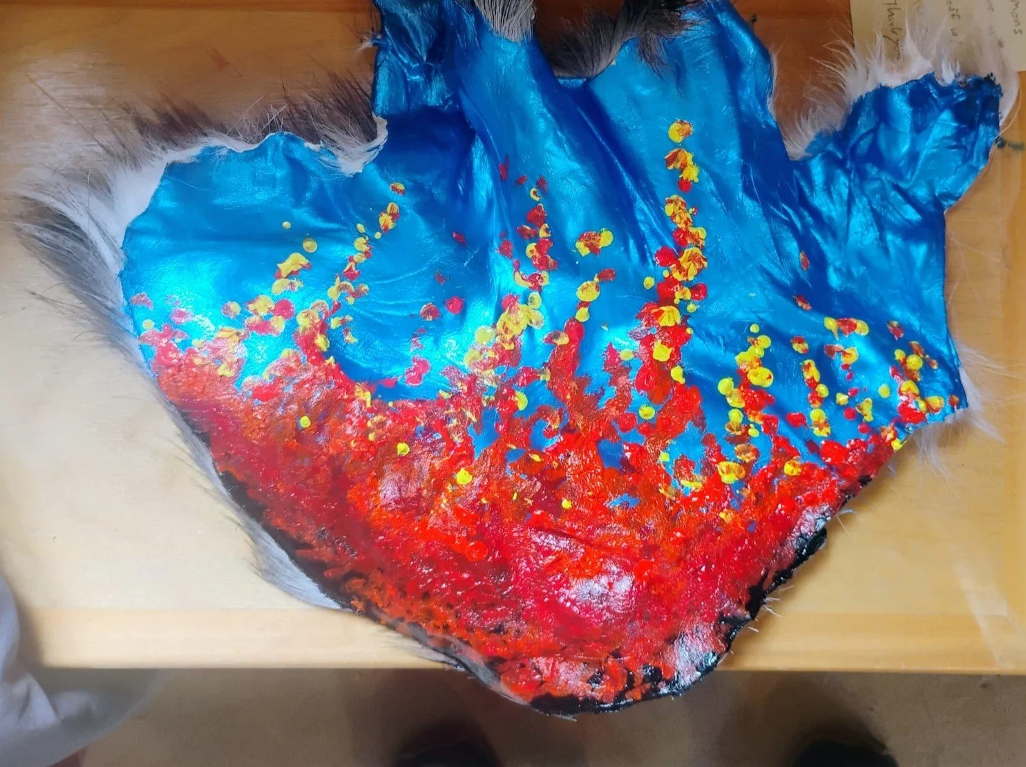 (Acrylic on ashed goat hide) by a student of the Ecology Learning Center