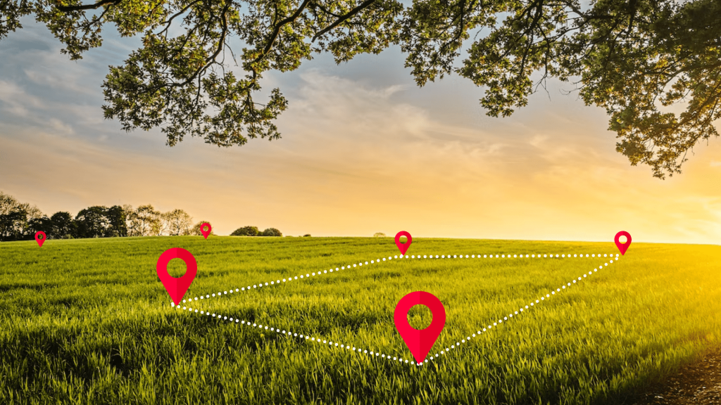 A grassy field with a few trees in the background and a large tree overhead, sunset sky, and five red location markers connected by dotted lines, indicating a path or route.