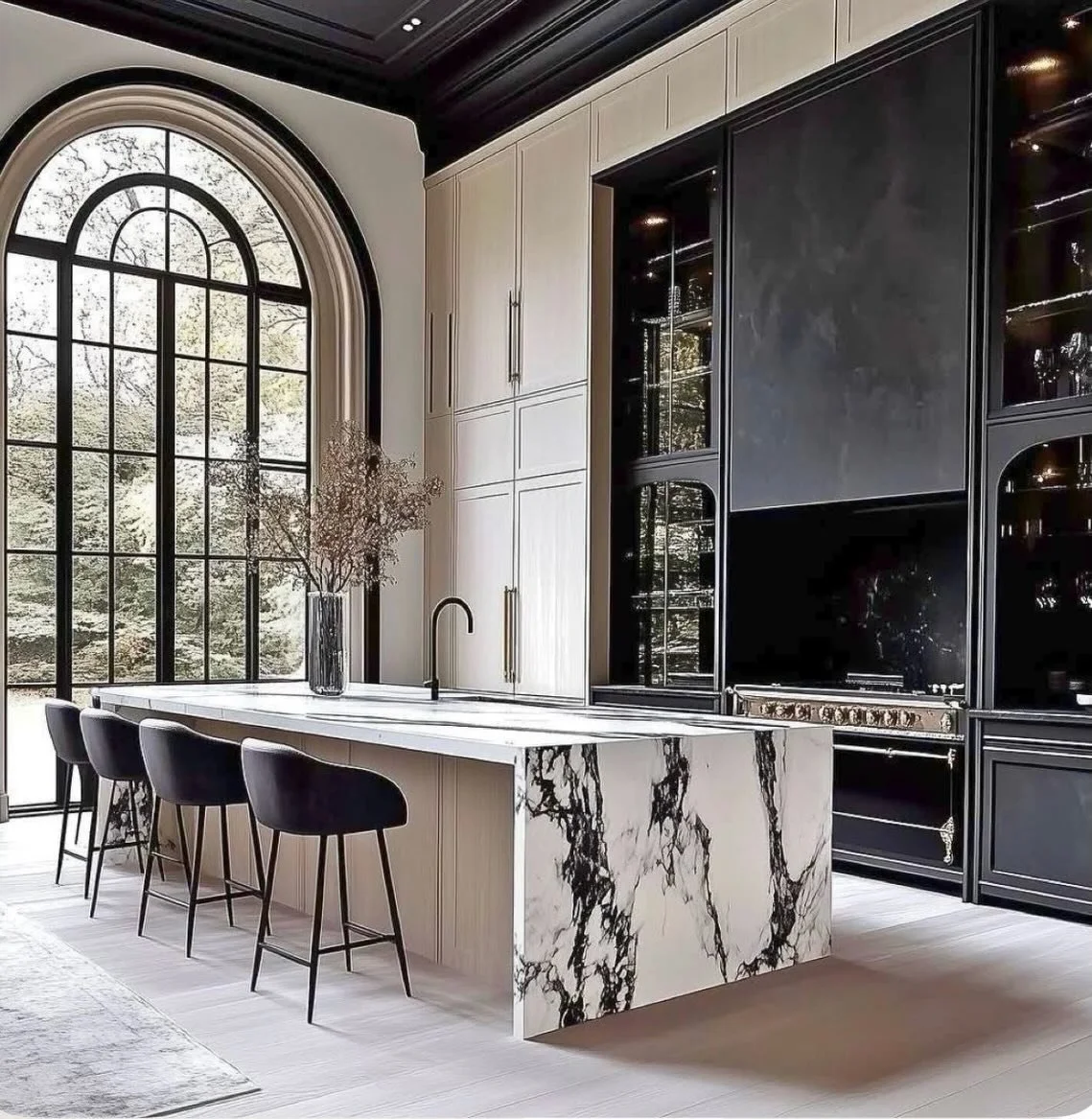 Obsessed with this modern organic kitchen moment 🤍
The contrast of bold marble, soft wood tones, and dramatic black accents creates the perfect balance of warmth and luxury.

This is what happens when everyday living meets elevated design ✨

Would y