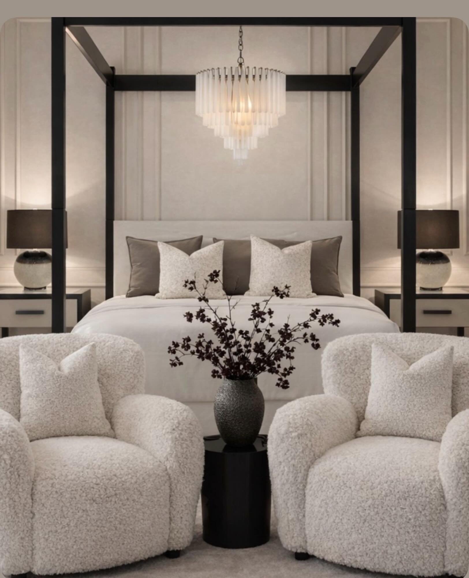 Designed to feel like a true retreat, warm neutrals, rich contrast, and layered textures come together to create a space that feels both refined and inviting. From the dramatic canopy bed to the soft boucle lounge chairs, every detail was selected to