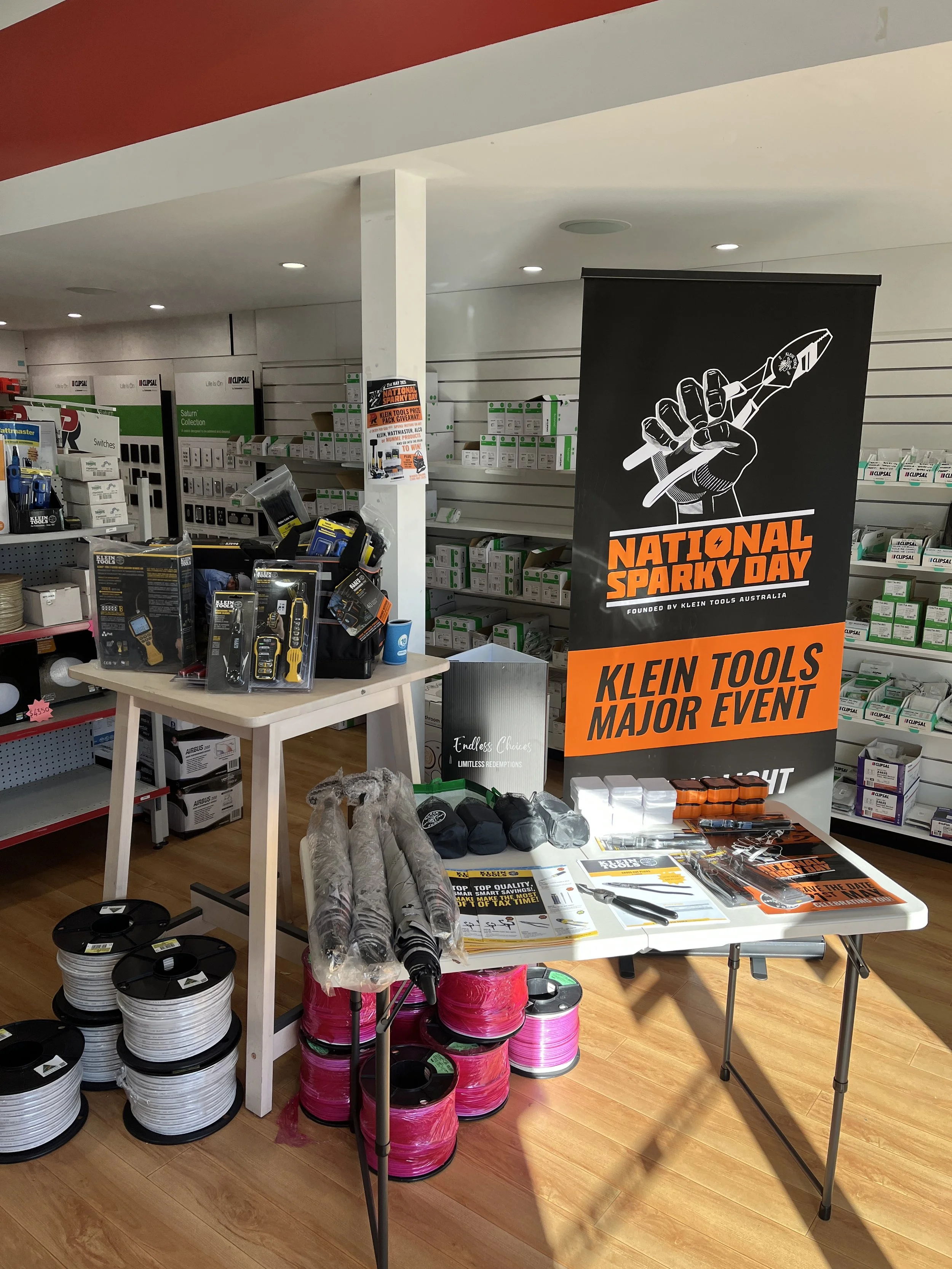 Display of tools and equipment at a retail store promoting the National Sparky Day event by Klein Tools