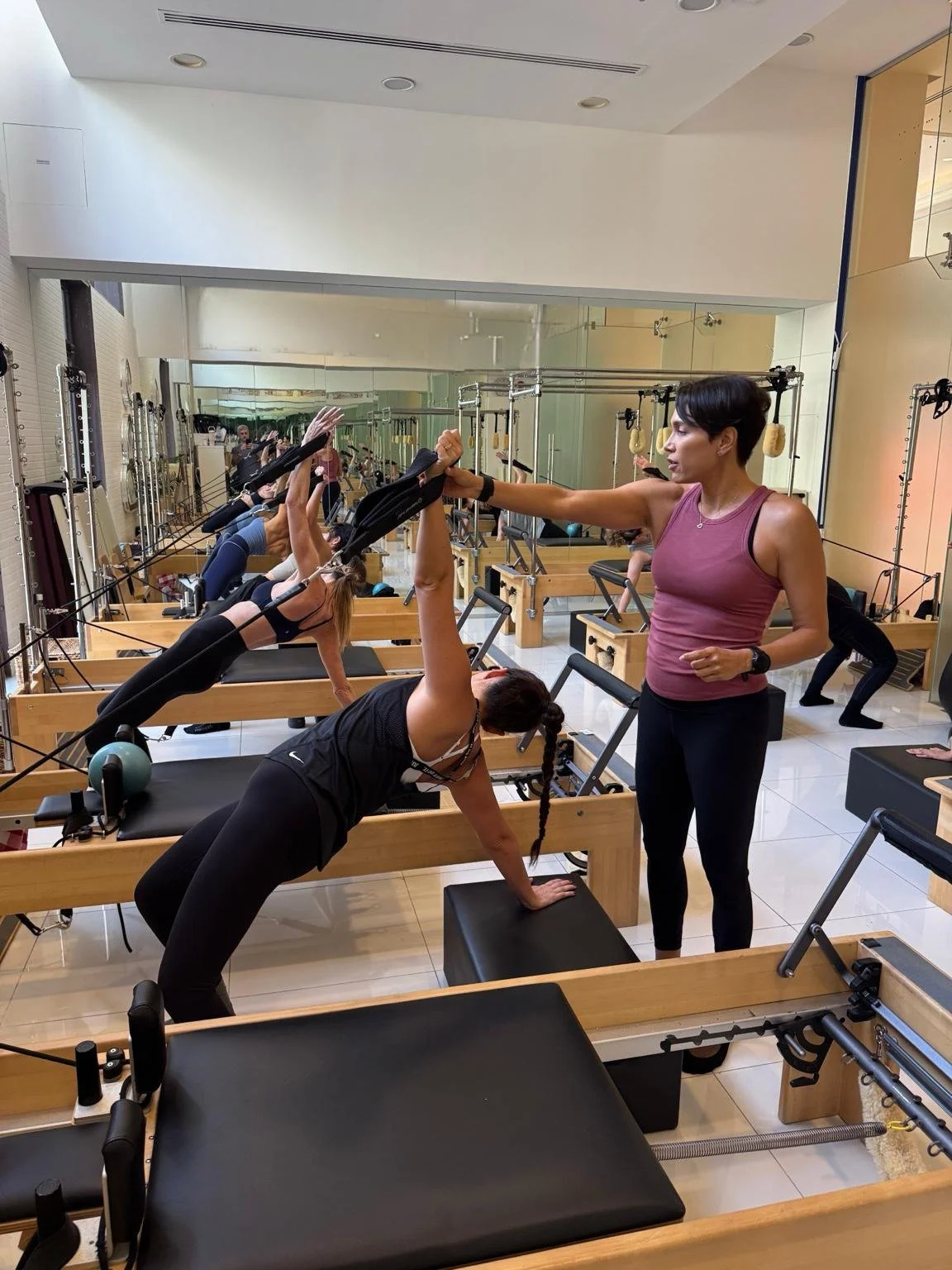 Paula Uribe teaching Pilates teacher training course Dubai — Balanced Body Reformer