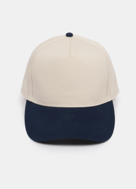 A two-tone baseball cap with a beige crown and a black brim.