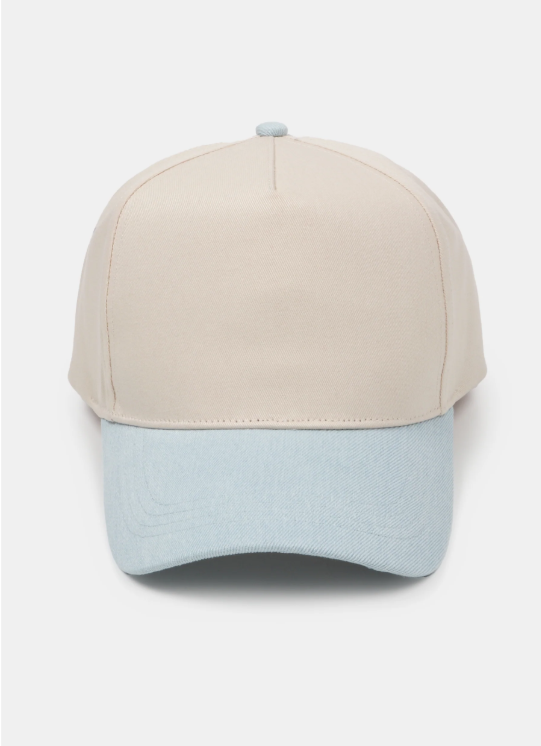 Beige and light blue baseball cap on a white background.
