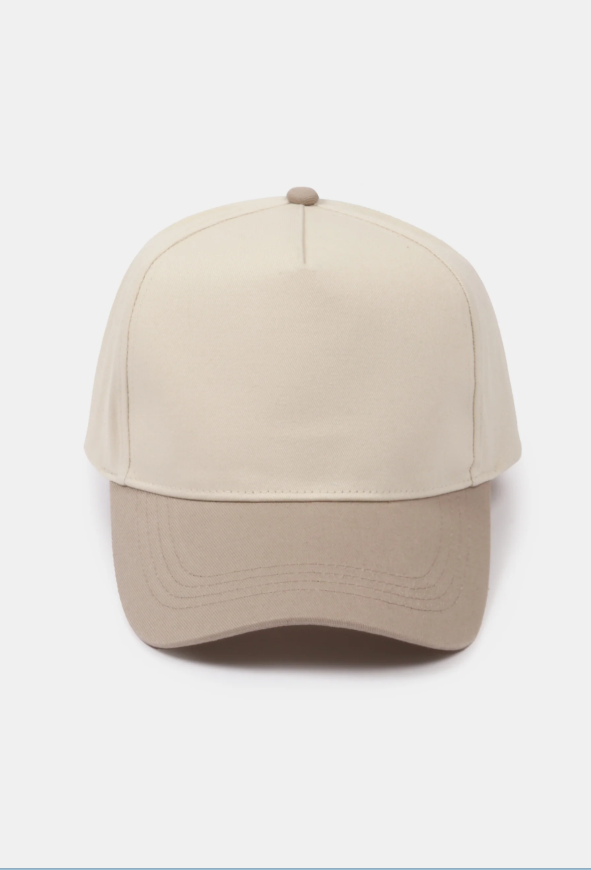 Beige and cream two-tone baseball cap on a white background.