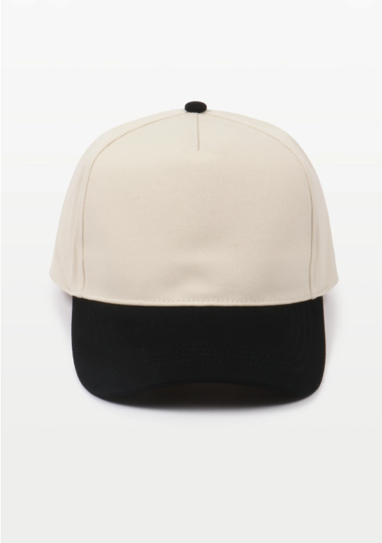 A two-tone baseball cap with a white crown and black brim, against a light background.