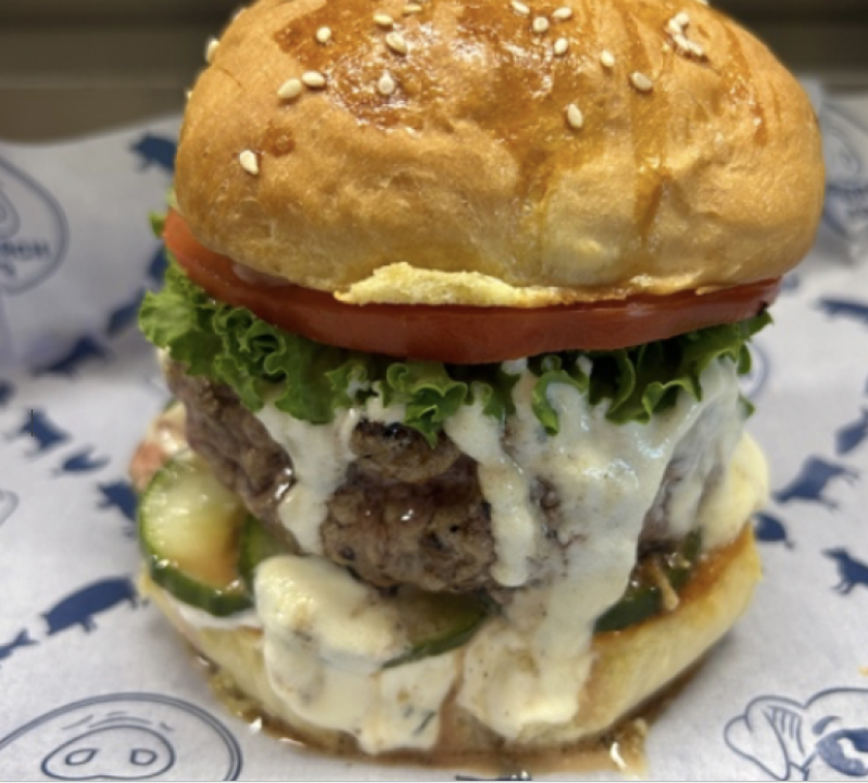 Lamburger on a bun with lettuce and tomato