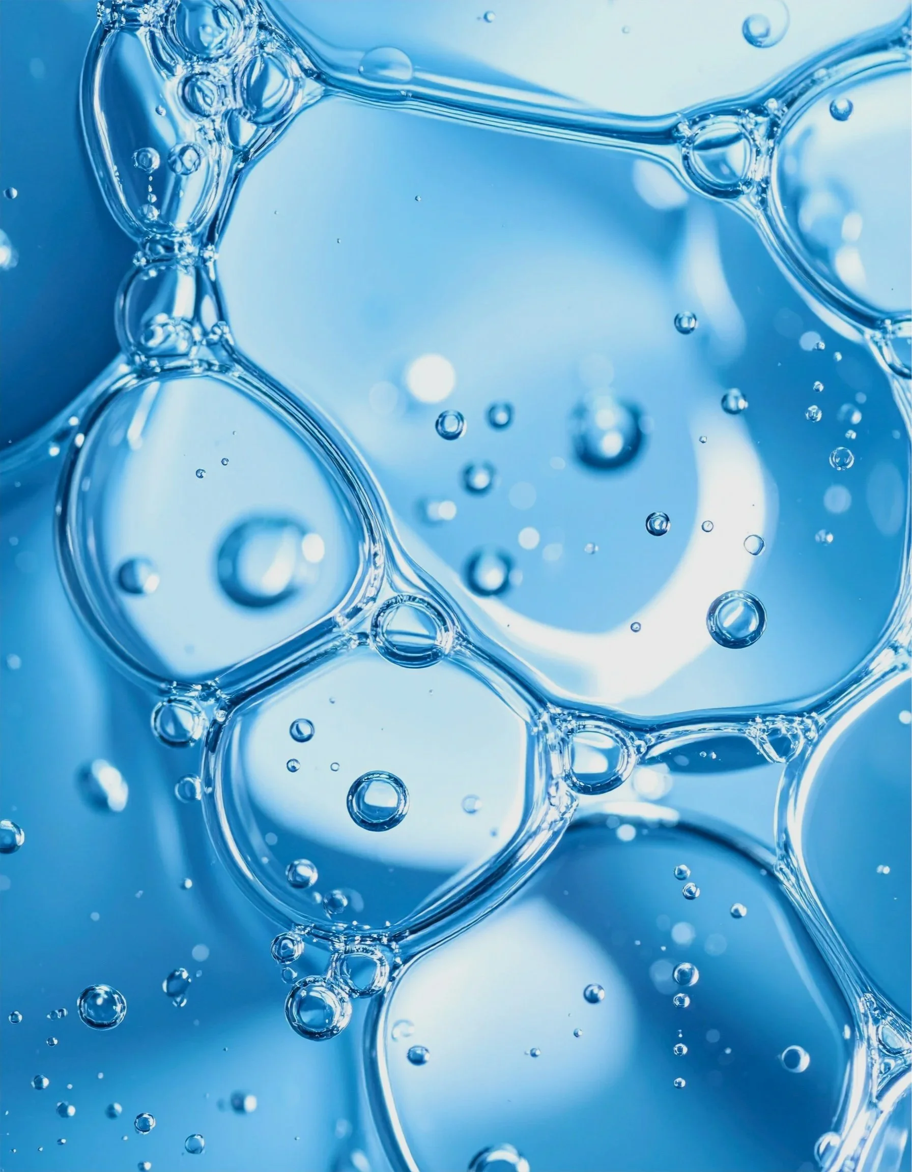 Extreme close up of blue liquid droplets all squished together