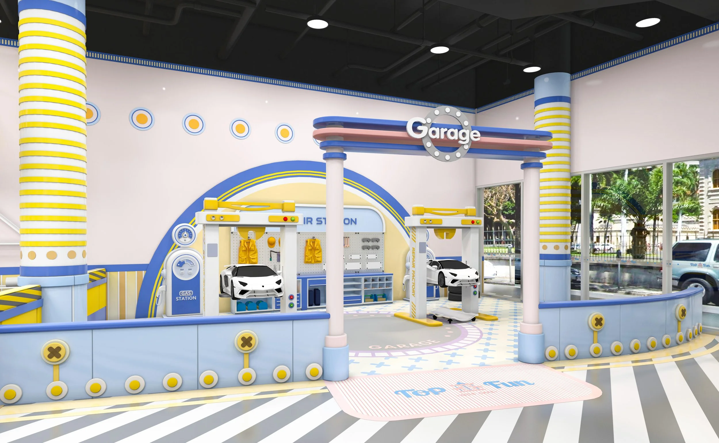 Child's play area designed as a car garage with toy cars, gas station, and automotive tools, featuring bright blue, pink, yellow, and white colors, with large windows and outdoor view.