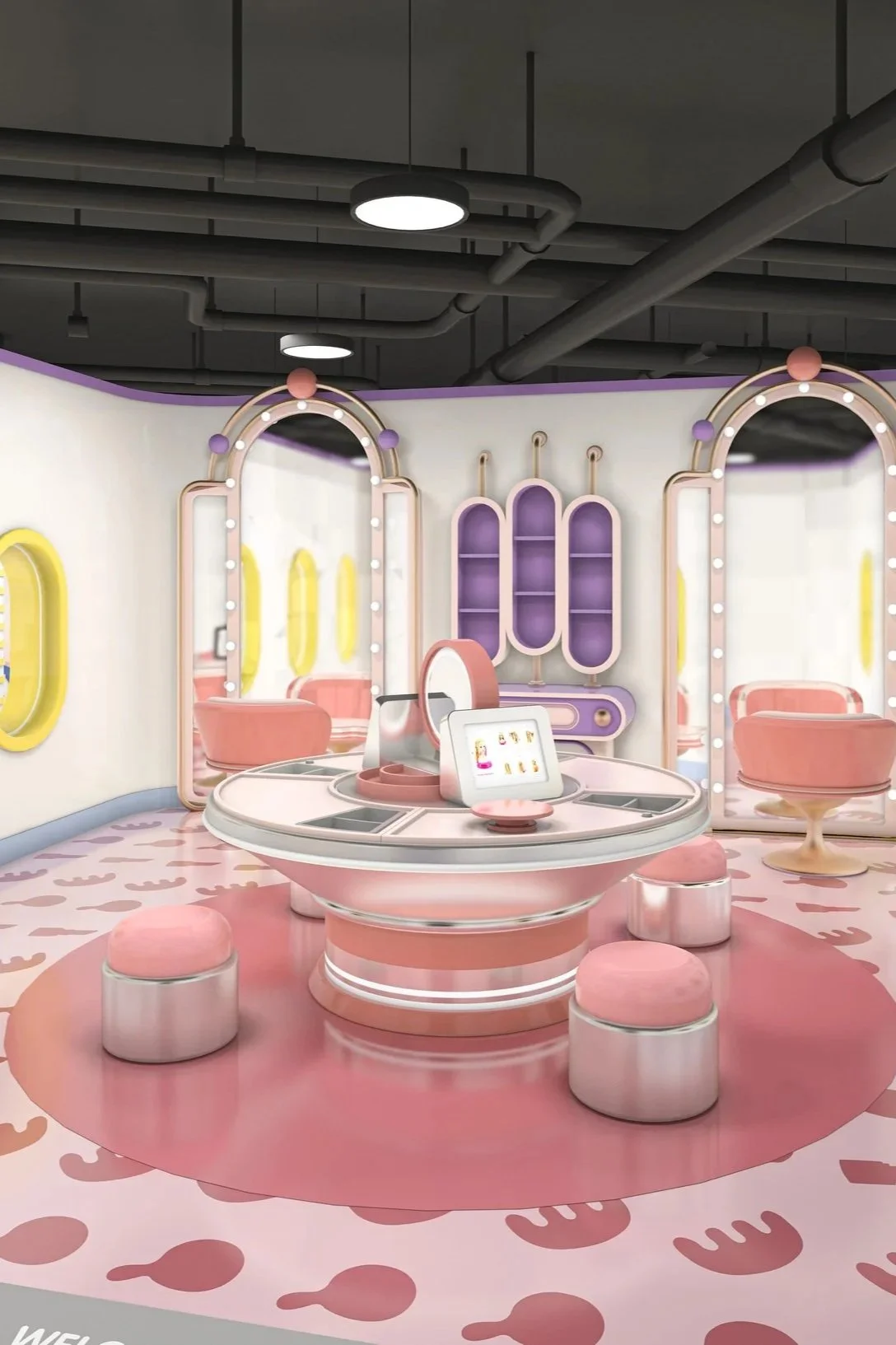 A pastel-colored, modern interior space with a round table at the center surrounded by pink stools, pink and purple furniture, and mirrors with light bulbs, all with a playful, whimsical design.