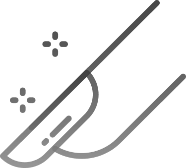 Close-up of a gray sofa with a person seated on it, using a laptop.