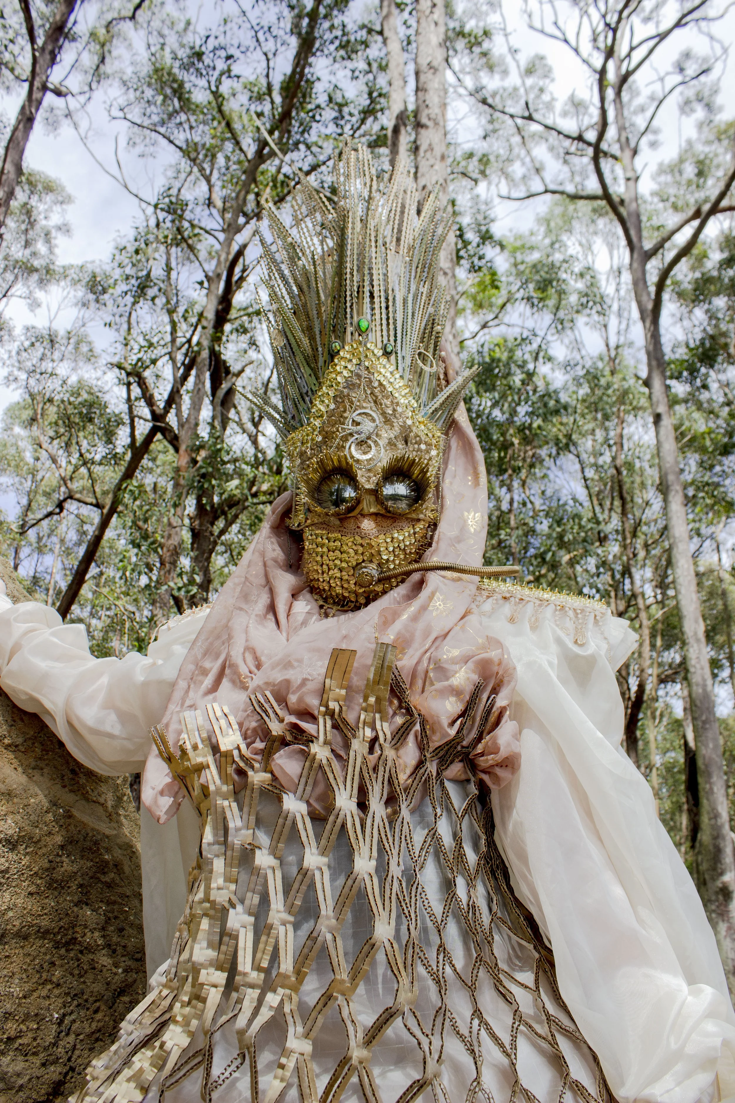 'Desert Queen Warrior' 2021.
Mixed media repurposed wearable 
sculpture. Featuring second hand fabrics, cardboard packaging, 
push pins, spaghetti, fashion accessories and zip ties.
Headpiece featured in Festival X, WattSpace Gallery UoN.
Model: Jana