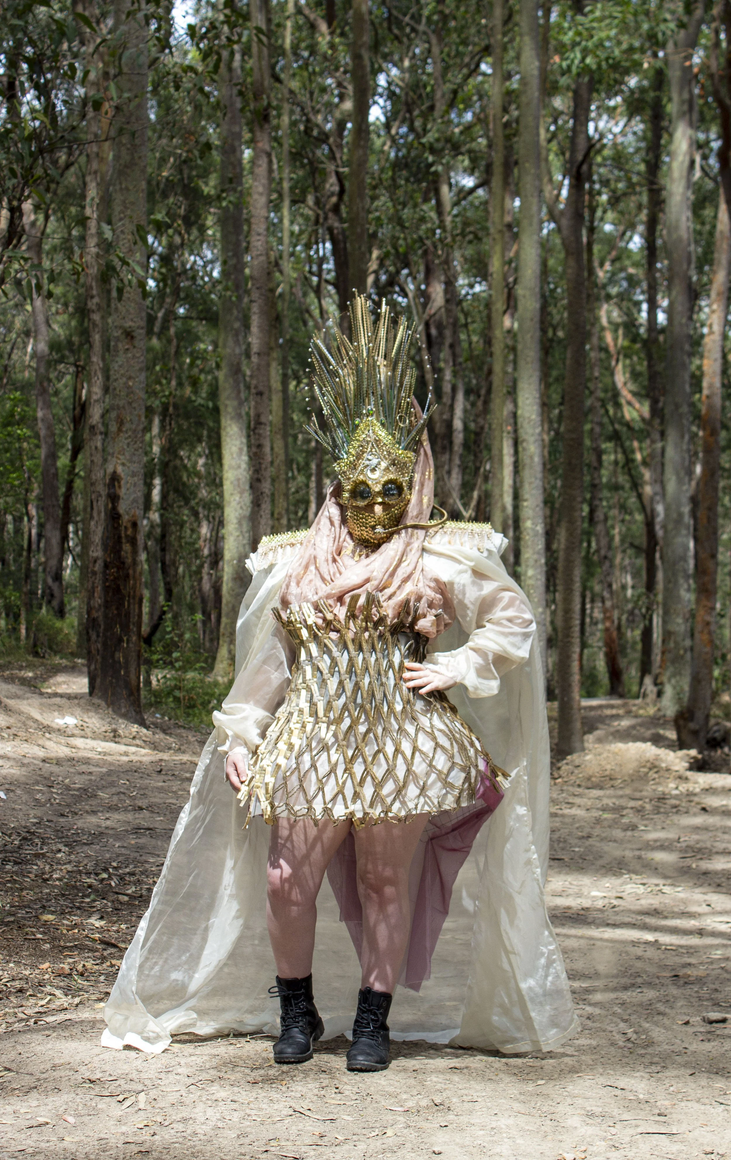 'Desert Queen Warrior' 2021.
Mixed media repurposed wearable 
sculpture. Featuring second hand fabrics, cardboard packaging, 
push pins, spaghetti, fashion accessories and zip ties.
Headpiece featured in Festival X, WattSpace Gallery UoN.
Model: Jana