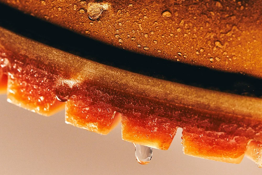 Close-up of the sole of a Timberland boot with water droplets dripping off the edge.