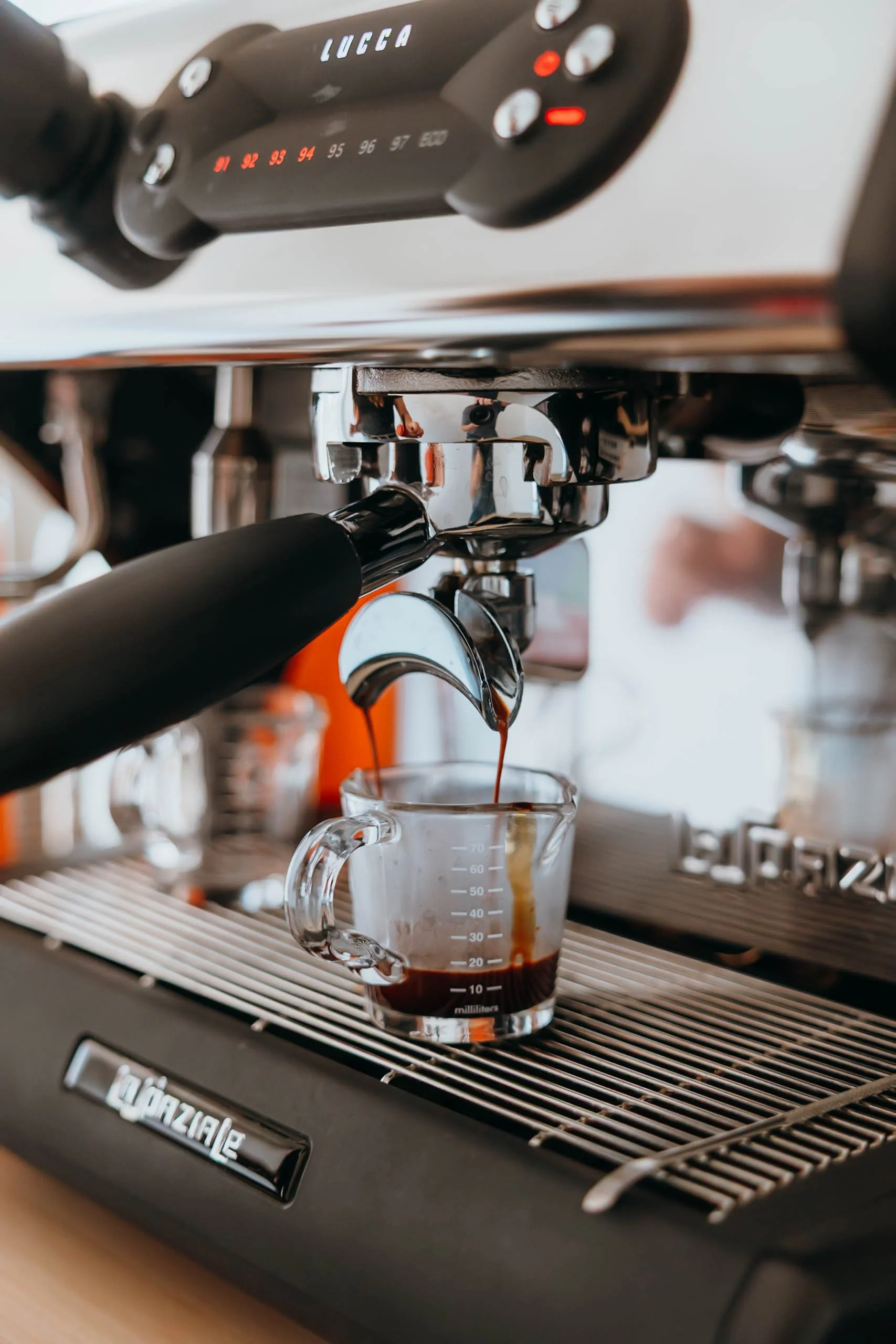 Rejuvenation Coffee Co. espresso machine pulling fresh espresso shots for handcrafted coffee drinks.